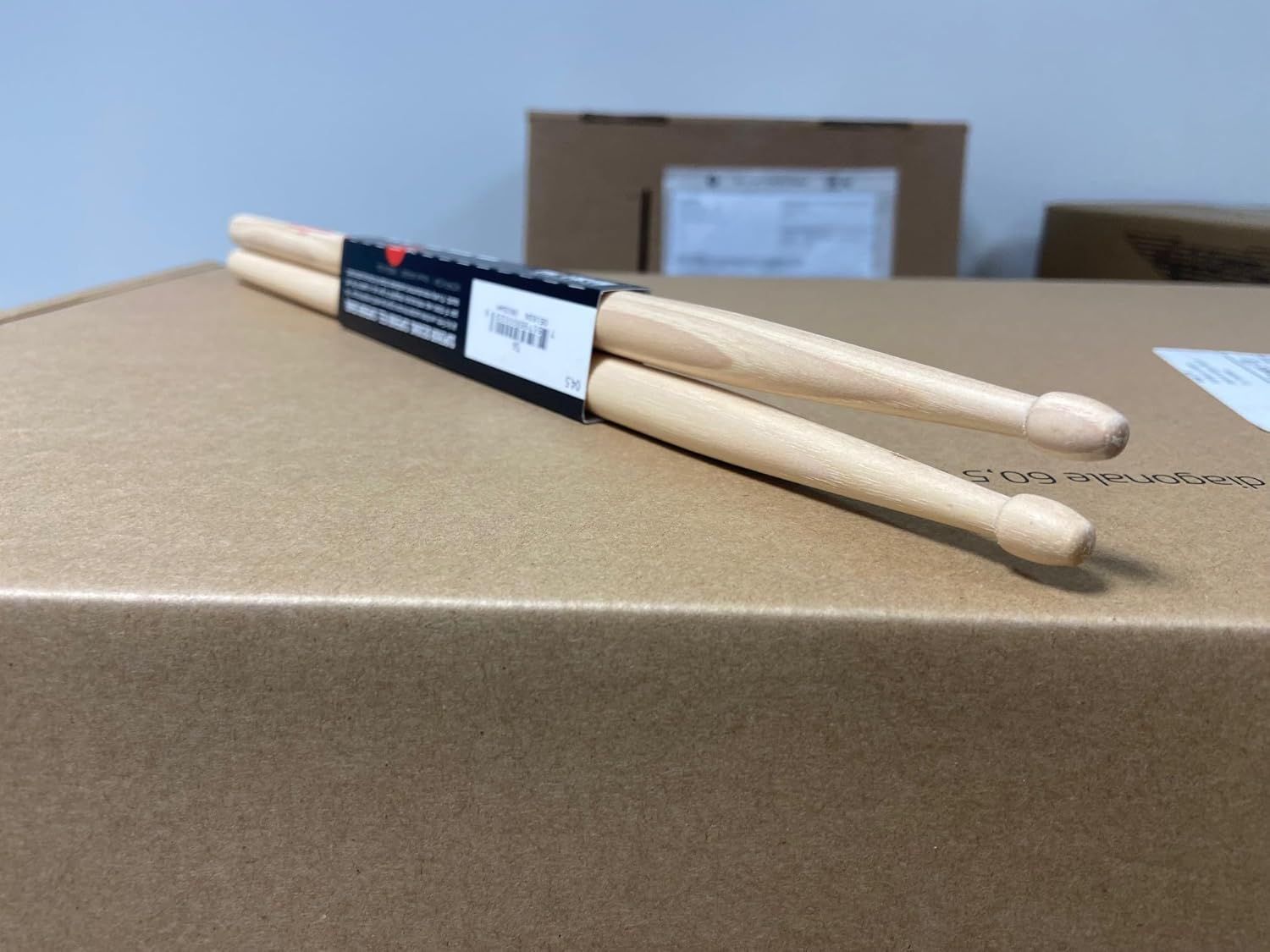 Shows the drumsticks with their retail packaging in a clean, catalog-style presentation to give shoppers a clear view of the product as it will arrive.