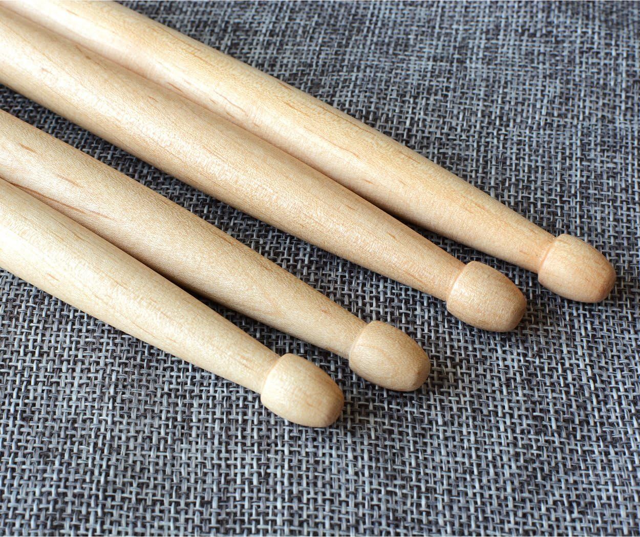 Provides a clean, catalog-style view of the wooden drumsticks on a neutral background to show the product clearly without distractions.
