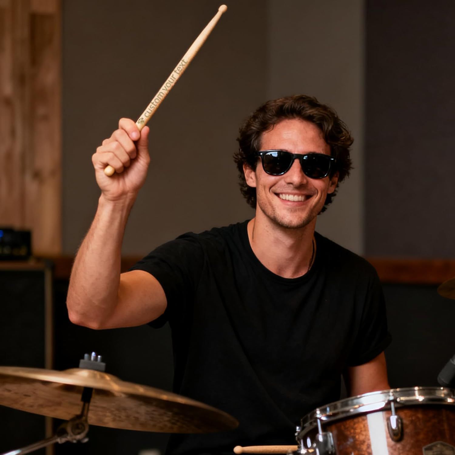 Shows the product (drumstick) being used in a real-world musical setting to help shoppers visualize themselves using it and connect emotionally with the product.