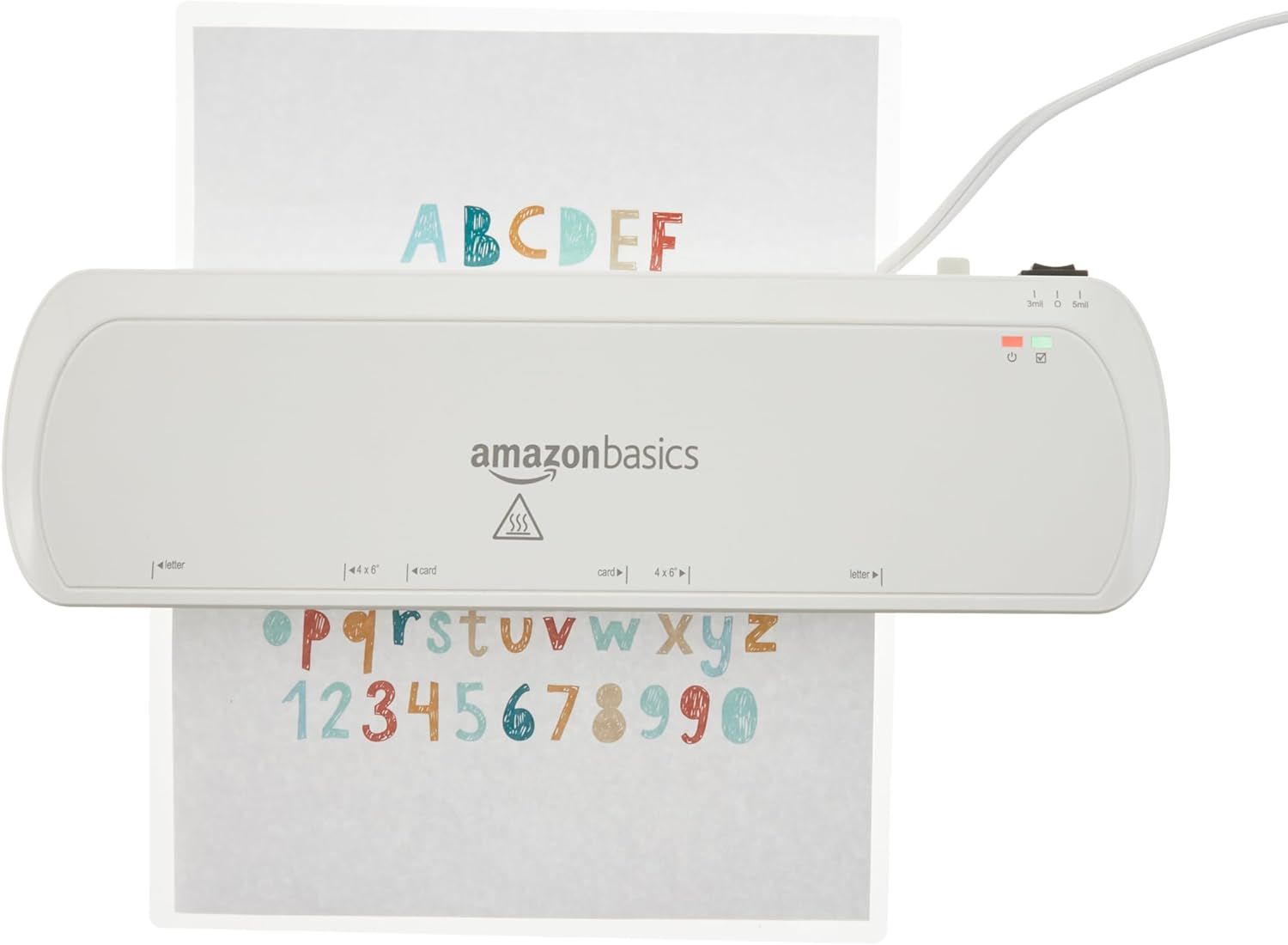 Provides a clean, catalog-style product image showing the AmazonBasics laminator in use with a sample document, allowing shoppers to see the product clearly without distractions.
