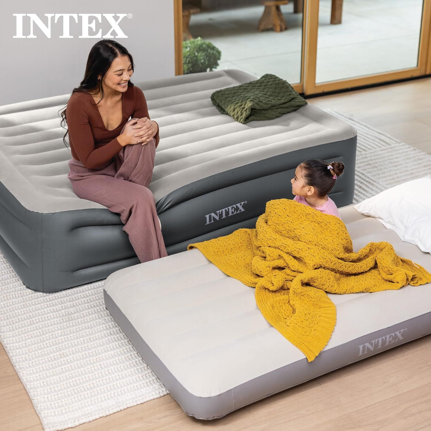 Demonstrates the product in a real-world home setting with a mother and child, showing how the air mattress can be used comfortably for family situations and creating an emotional connection with…