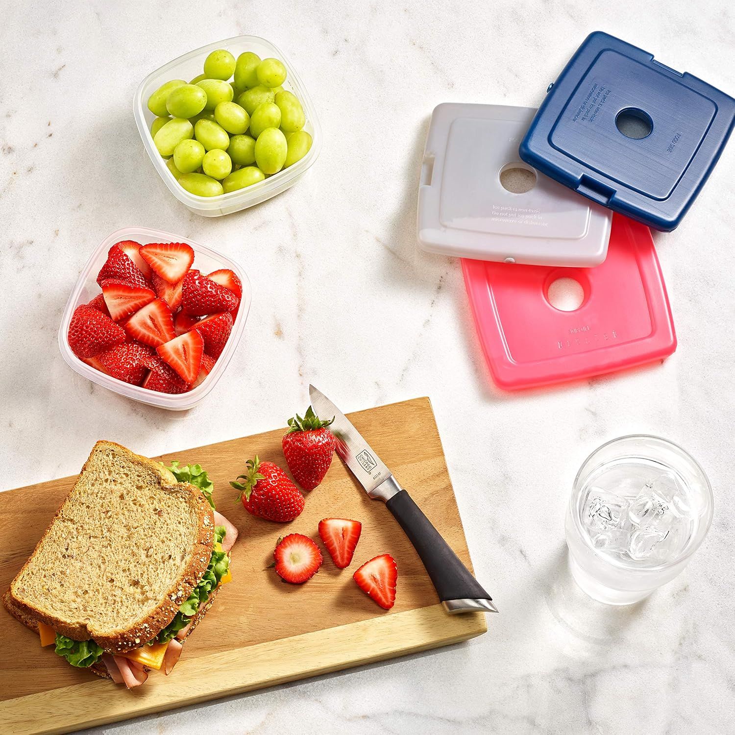 Demonstrates the product in a real-world lunch preparation context to help shoppers visualize how the containers fit into their daily routine.