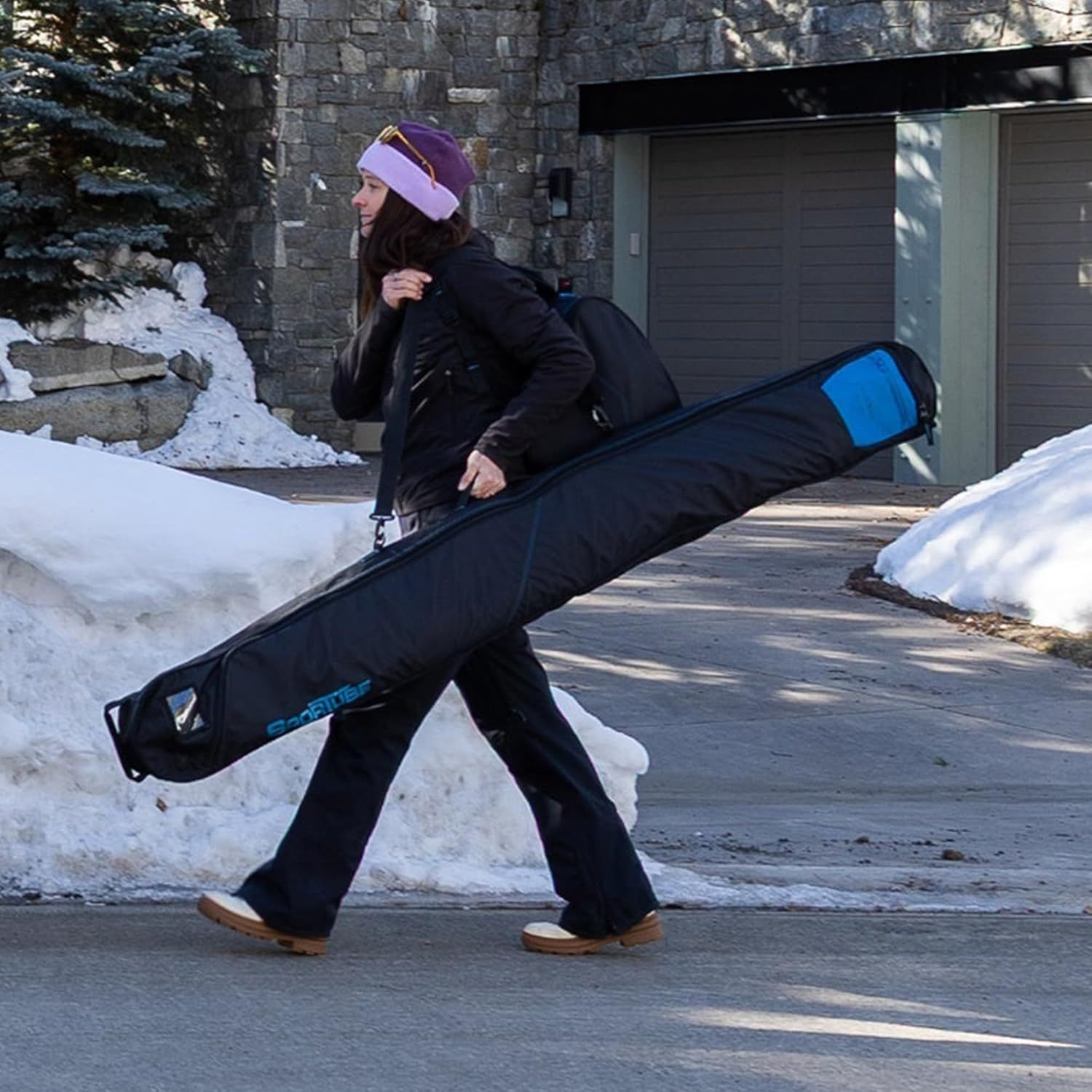 Demonstrates the product in a real-world winter/ski environment, showing how easily it can be carried and transported to outdoor activities.