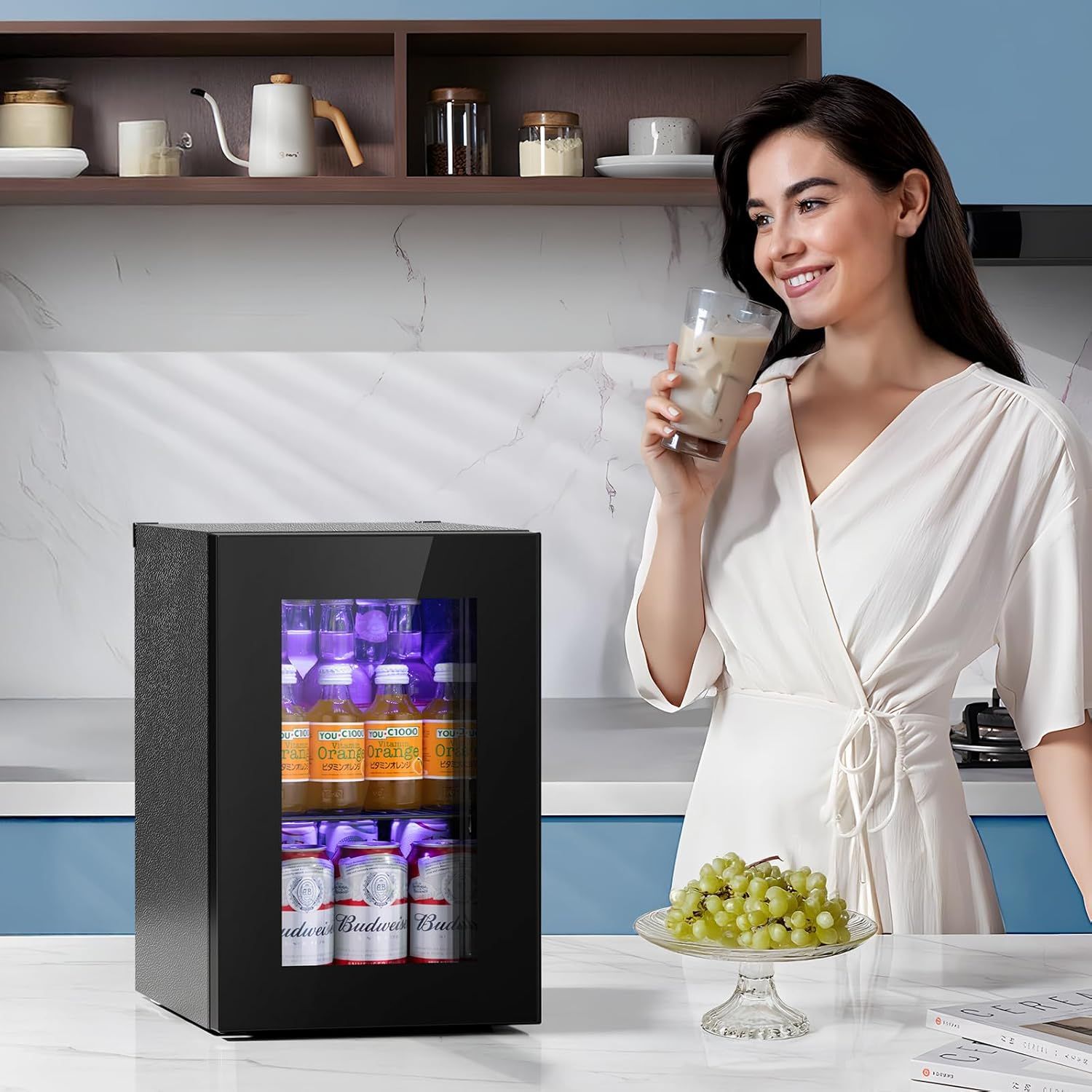 Demonstrates the product in a real-world kitchen environment to help shoppers visualize how the beverage cooler fits naturally into their home lifestyle.