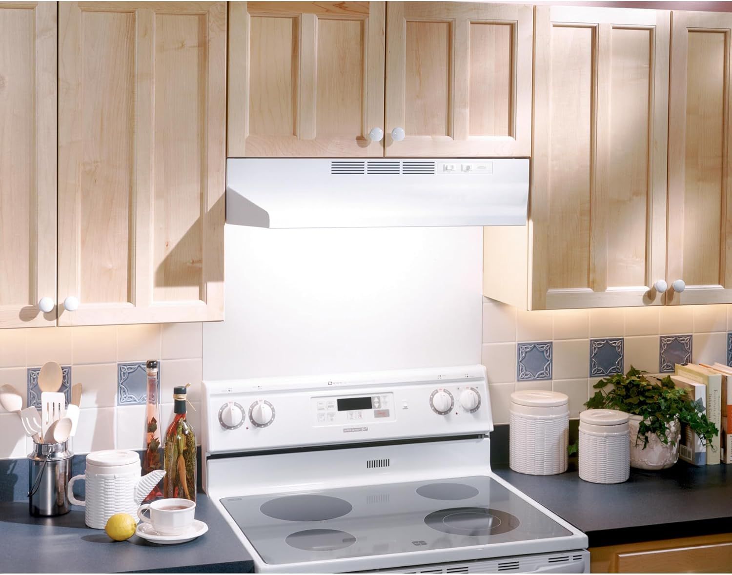 Demonstrates the product (range hood) installed in a real kitchen setting to help shoppers visualize how it looks and fits in their own home environment.