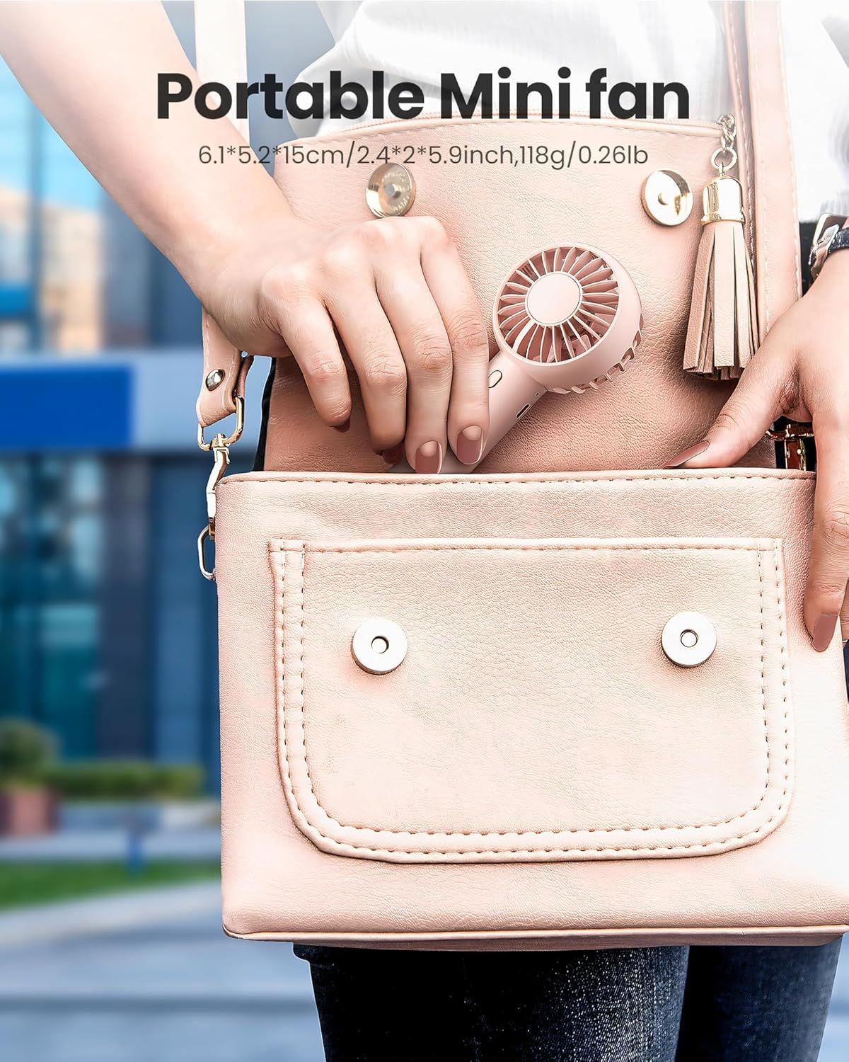 Communicates the exact physical dimensions and weight of the mini fan to reassure shoppers that it's truly portable and easy to carry. Highlights the product's portability benefit by showing it fits…