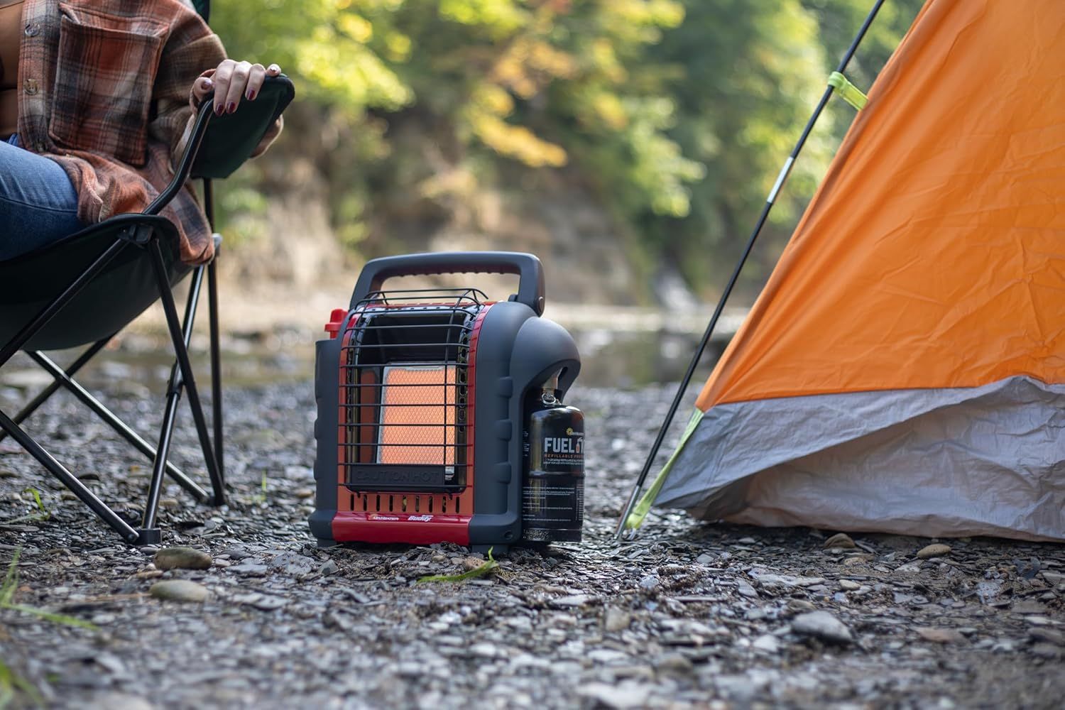 Demonstrates the portable heater in a real-world camping environment to help shoppers visualize using the product outdoors for warmth and comfort.
