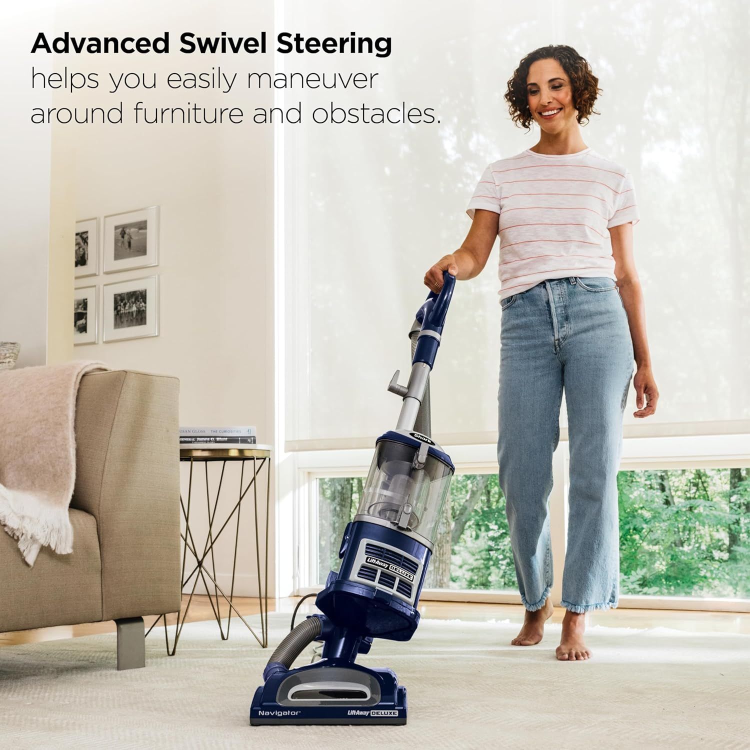 Demonstrates the vacuum's swivel steering feature, showing how easily it can navigate around furniture and obstacles in a home setting to reassure shoppers of its ease of use.