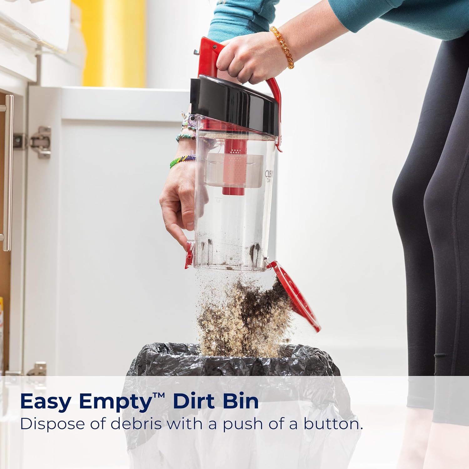 Demonstrates how simple it is to empty the vacuum's dirt bin with a push-button mechanism, reassuring shoppers that maintenance is quick and mess-free. Highlights the convenience of the one-button…