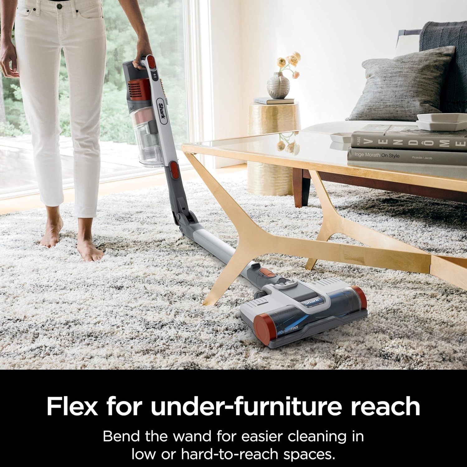 Demonstrates the vacuum's flexible wand feature that allows users to easily clean under furniture and hard-to-reach spaces, solving a common cleaning pain point.