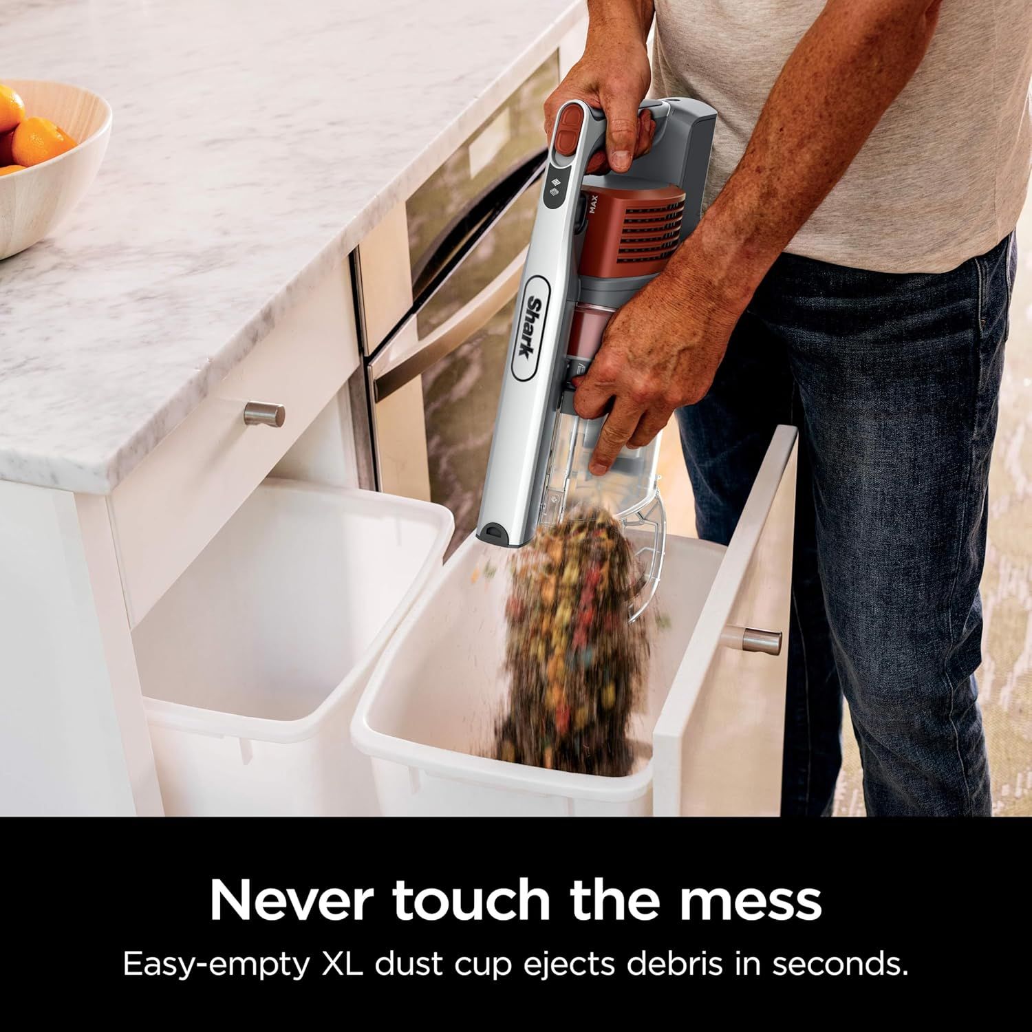 Demonstrates the convenience and hygiene of the XL dust cup's one-touch ejection system, reassuring shoppers they can dispose of debris quickly without touching the mess.