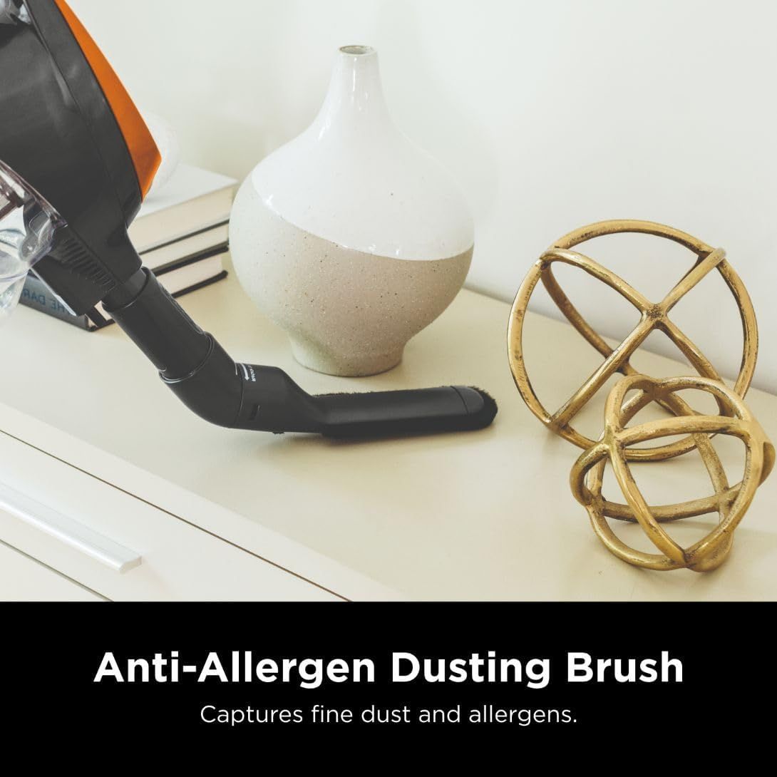 Communicates that the vacuum's dusting brush attachment effectively captures fine dust and allergens, reassuring shoppers concerned about air quality and allergen control.