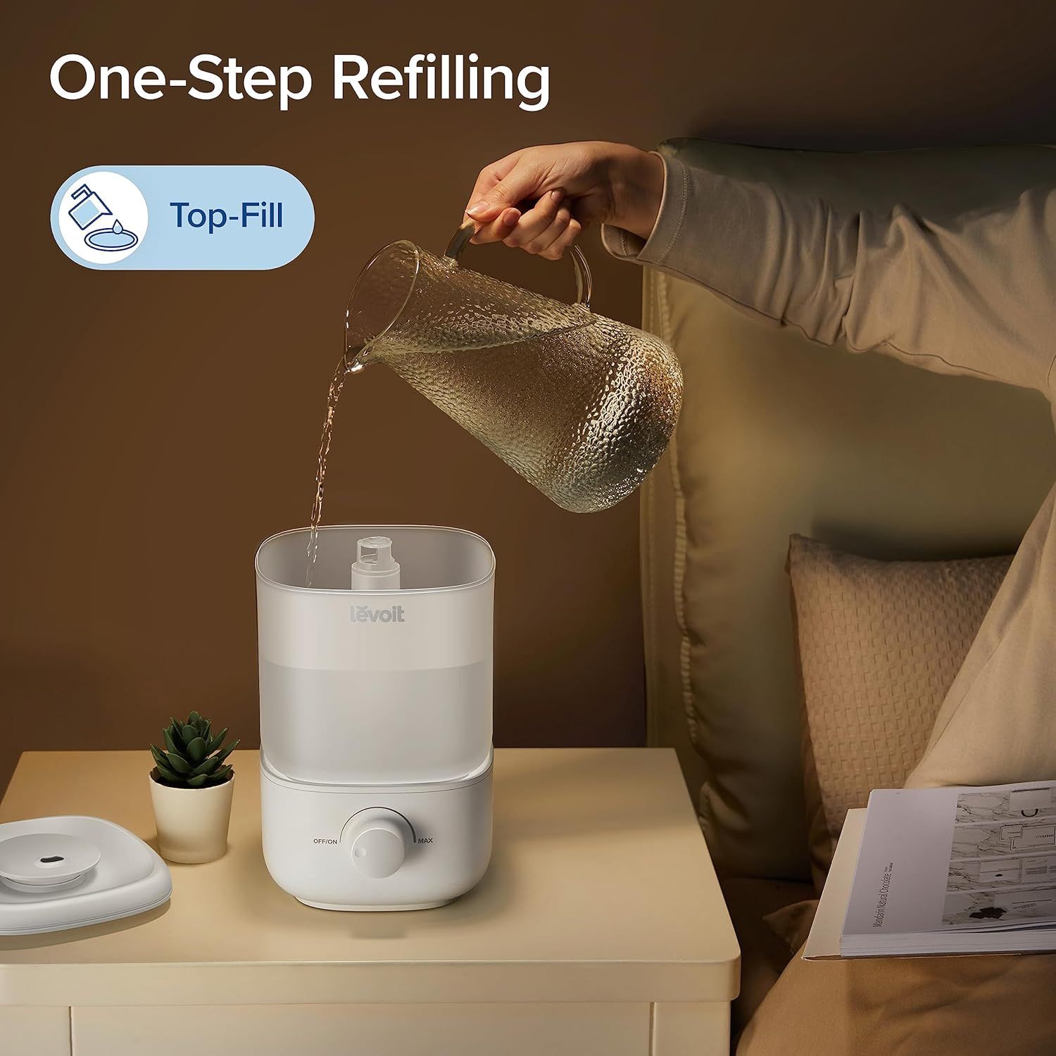 Demonstrates the simple, convenient top-fill refilling process to reassure shoppers that maintaining the humidifier is easy and mess-free. Highlights the ease-of-use benefit of the top-fill design,…