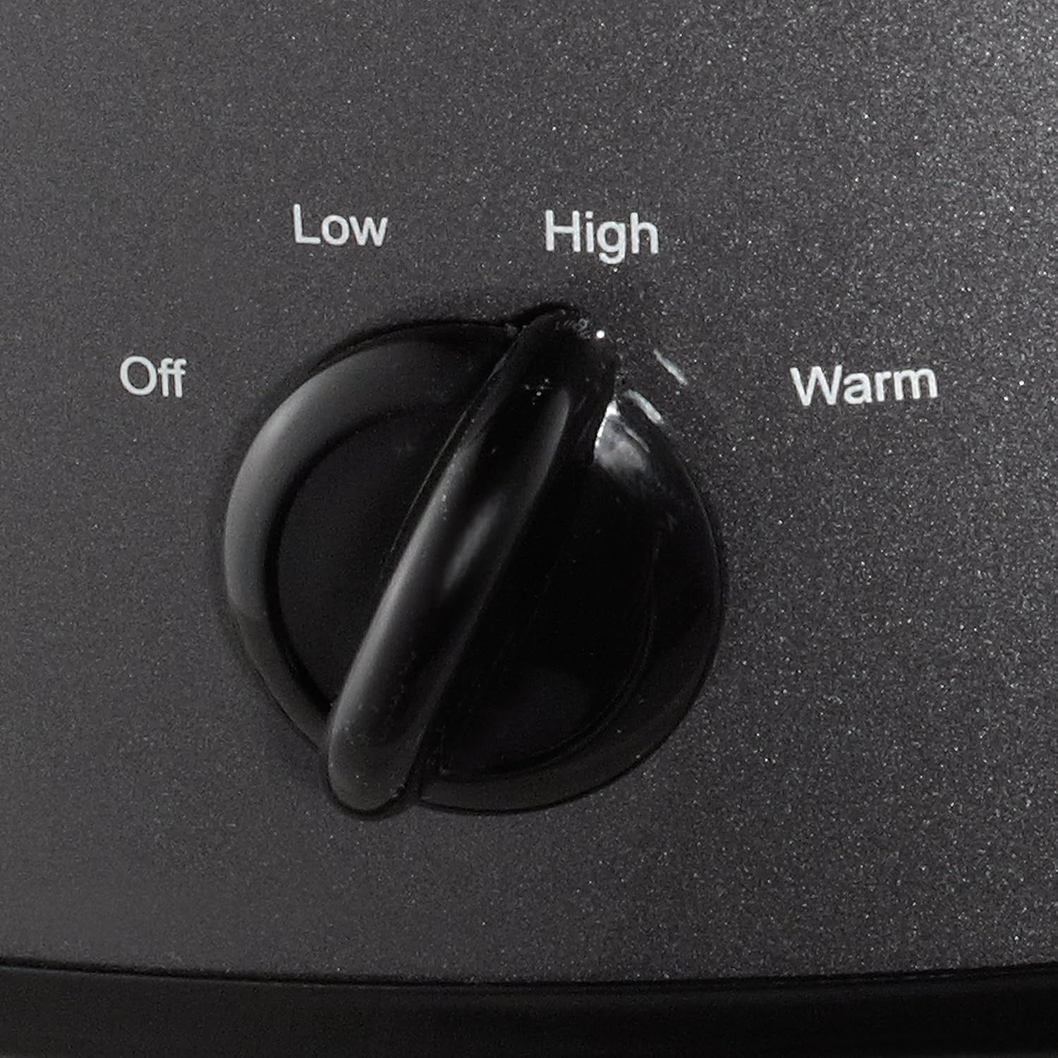 Shows the product's control interface with labeled settings (Off, Low, High, Warm) to help shoppers understand how to operate the appliance and what temperature/heat options are available.