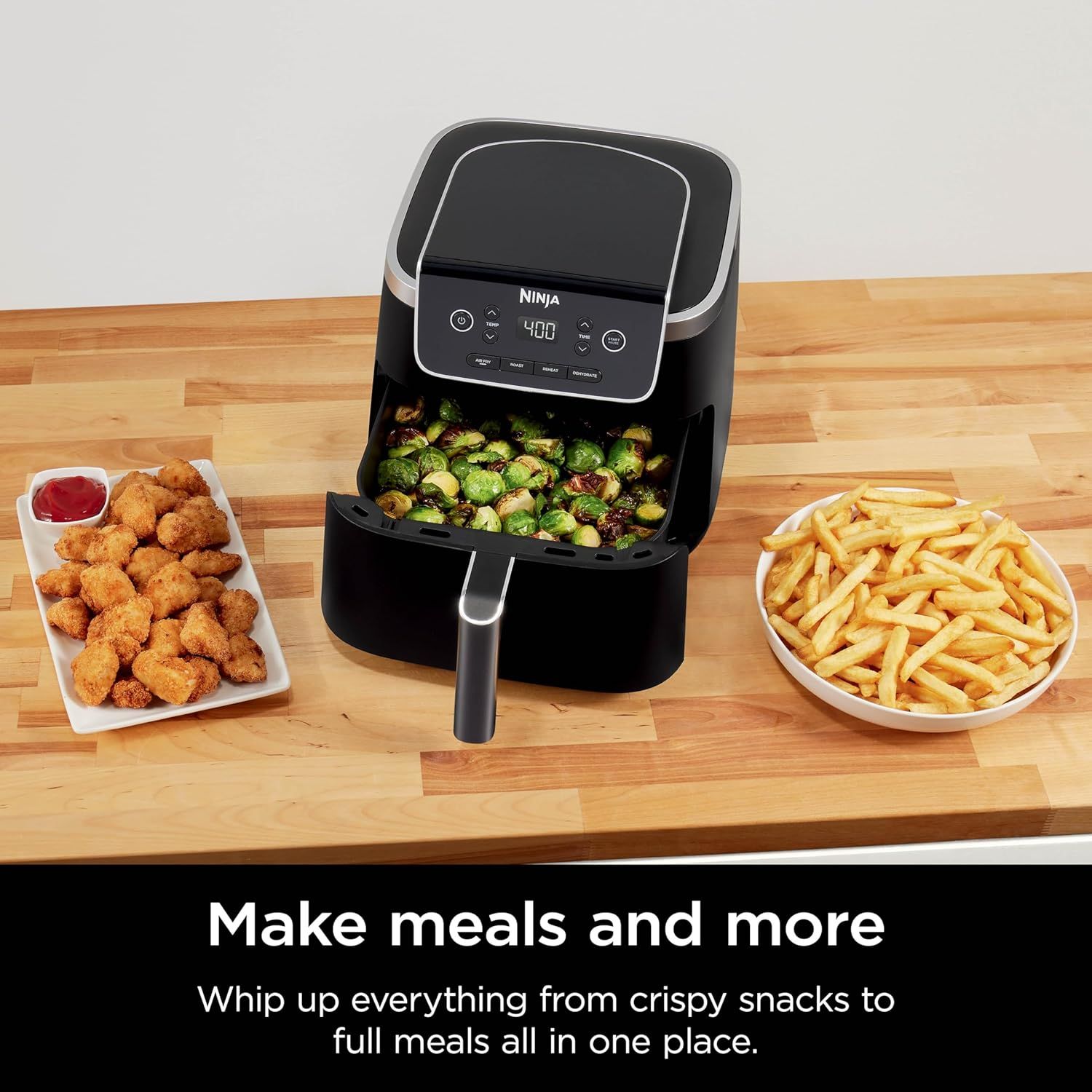 Demonstrates the air fryer's versatility by showing it can prepare multiple types of food (chicken nuggets, Brussels sprouts, and French fries), reassuring shoppers that it's suitable for various…