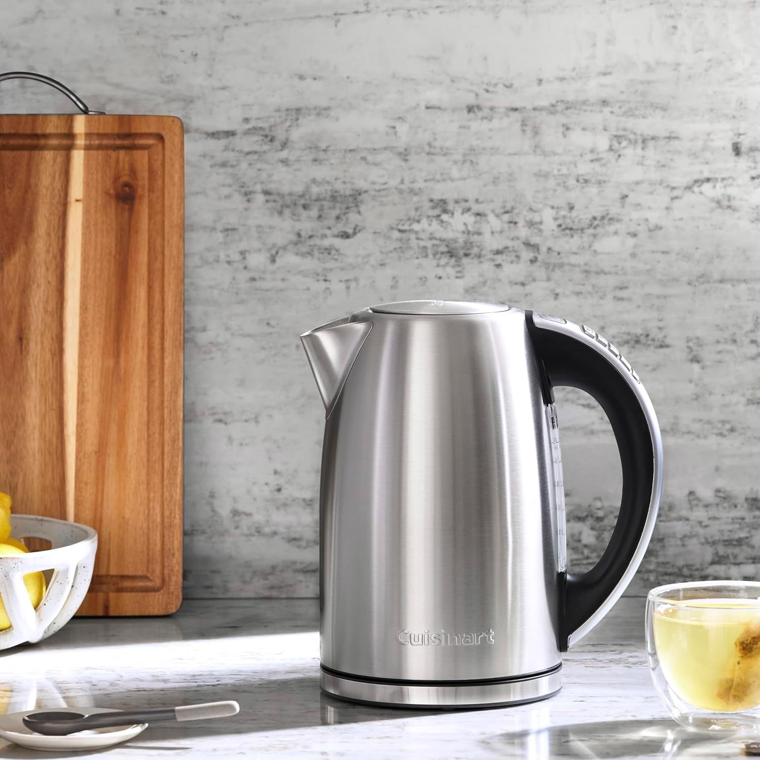 Showcases the electric kettle in a real-world kitchen setting to help shoppers visualize the product in their own home environment.