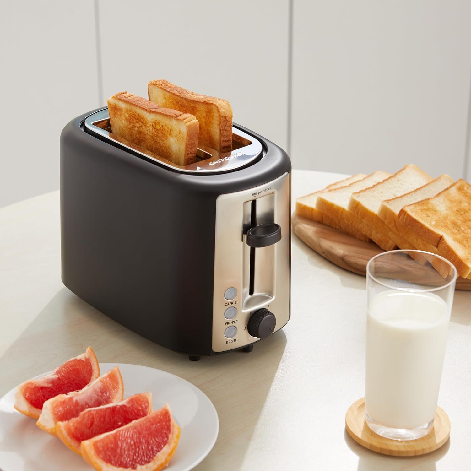 Demonstrates the toaster in an authentic kitchen environment to help shoppers visualize the product in their daily routine.