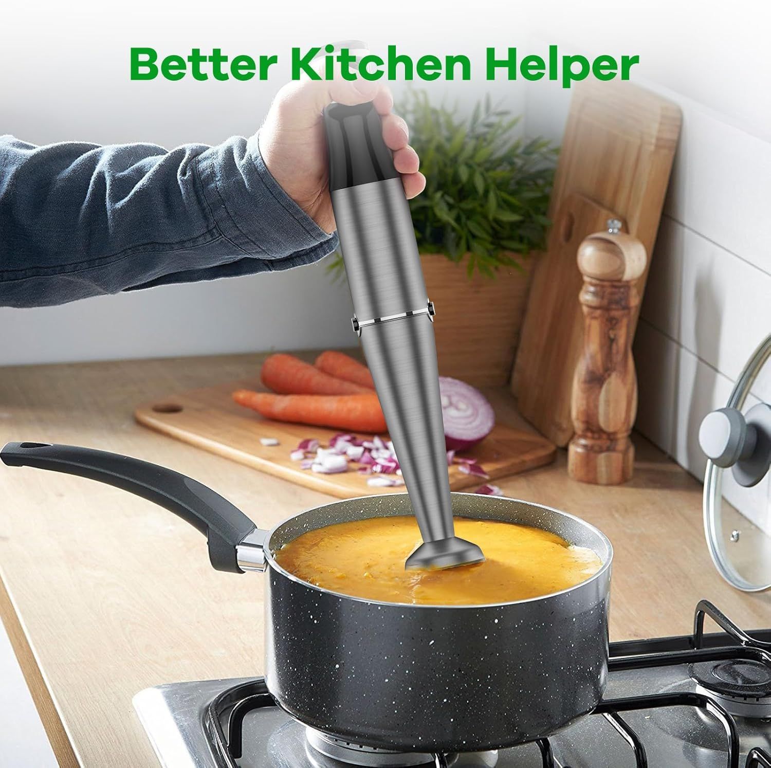 Demonstrates the product being used in a real kitchen environment to help shoppers visualize how the immersion blender fits into everyday cooking scenarios.