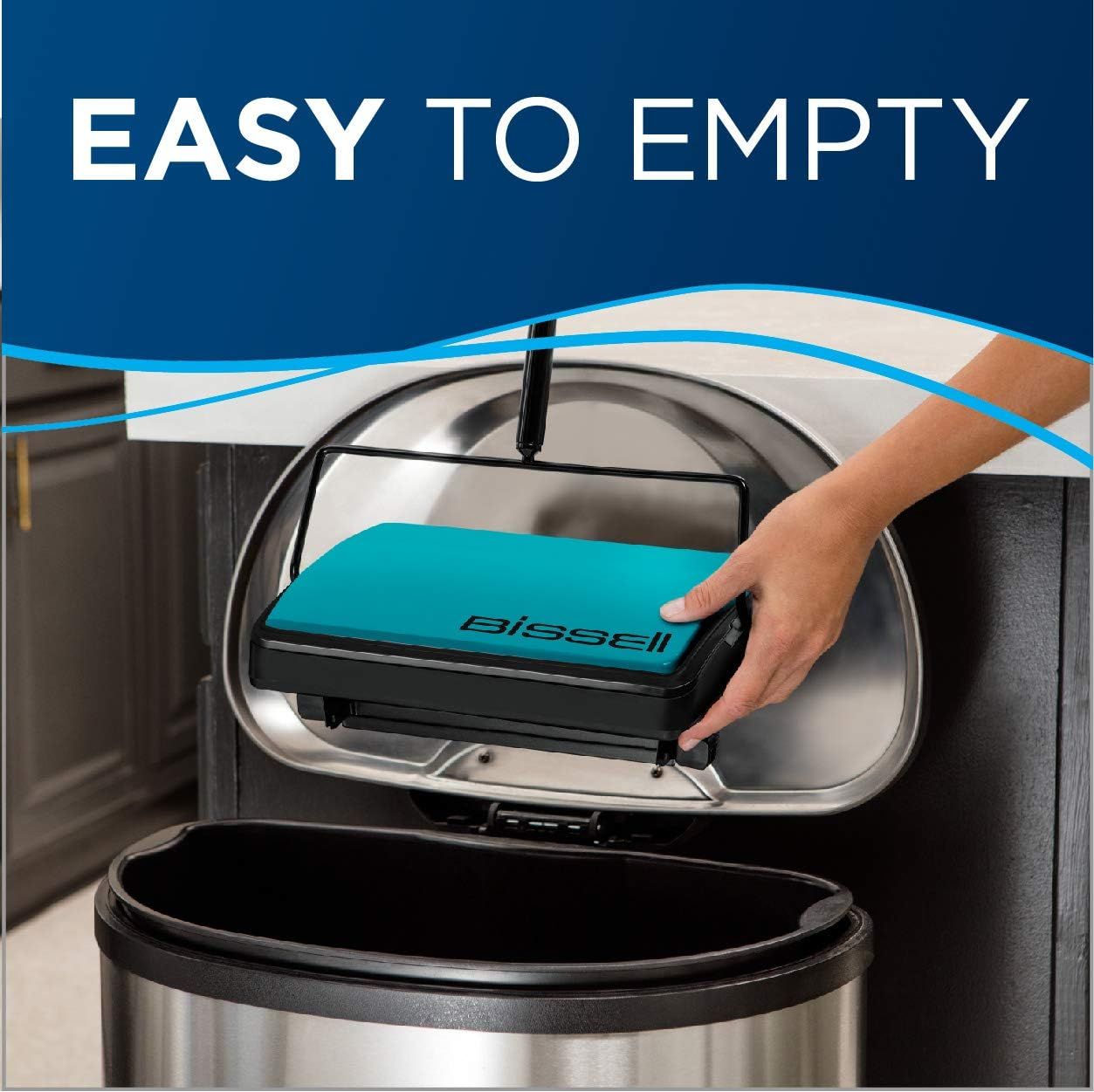 Demonstrates the convenience of emptying the vacuum's dustbin by showing a hand easily removing the dirt collection unit over a trash can, reassuring shoppers that maintenance is simple and…