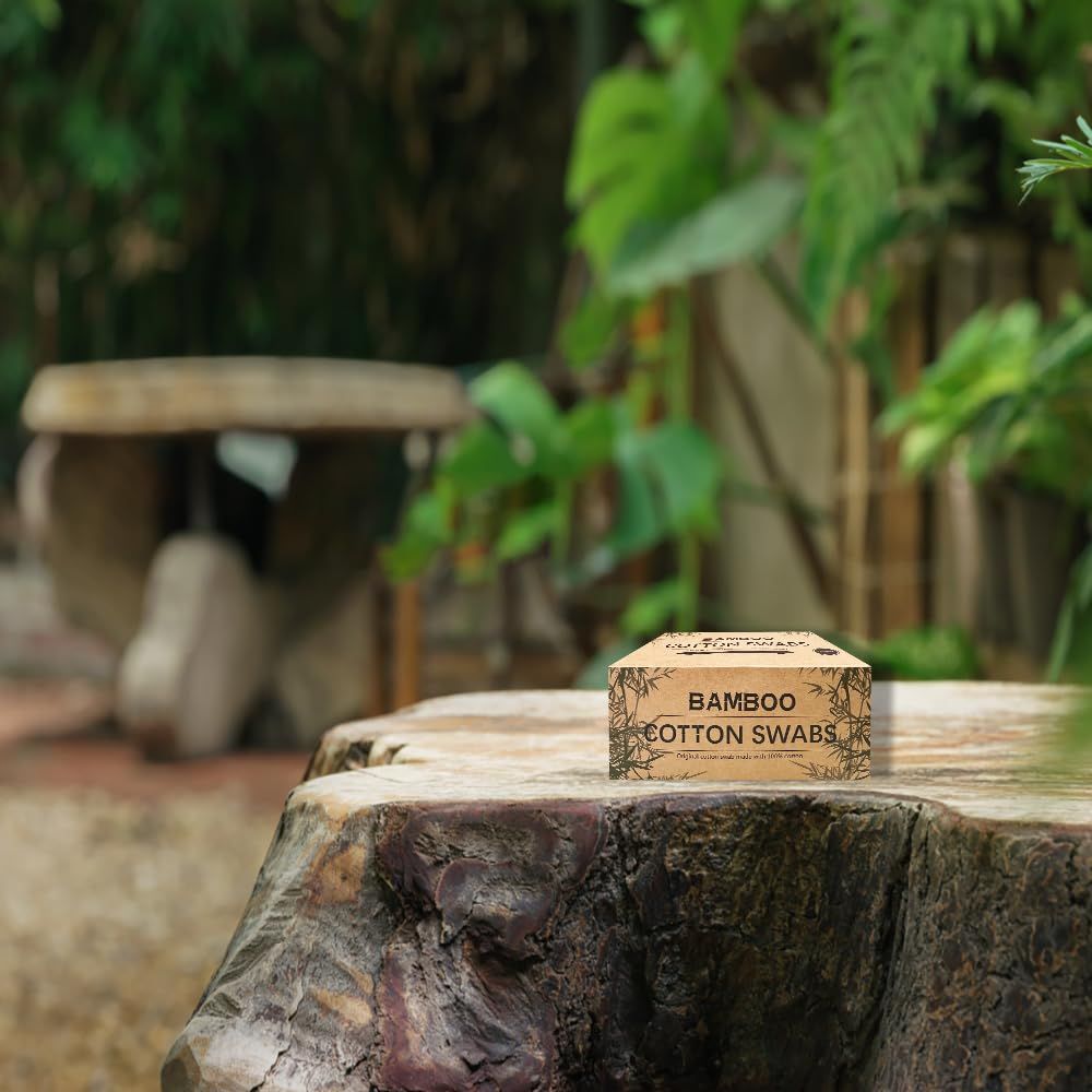 Showcases the bamboo cotton swabs product in a natural outdoor environment to reinforce its eco-friendly positioning and appeal to environmentally conscious shoppers.