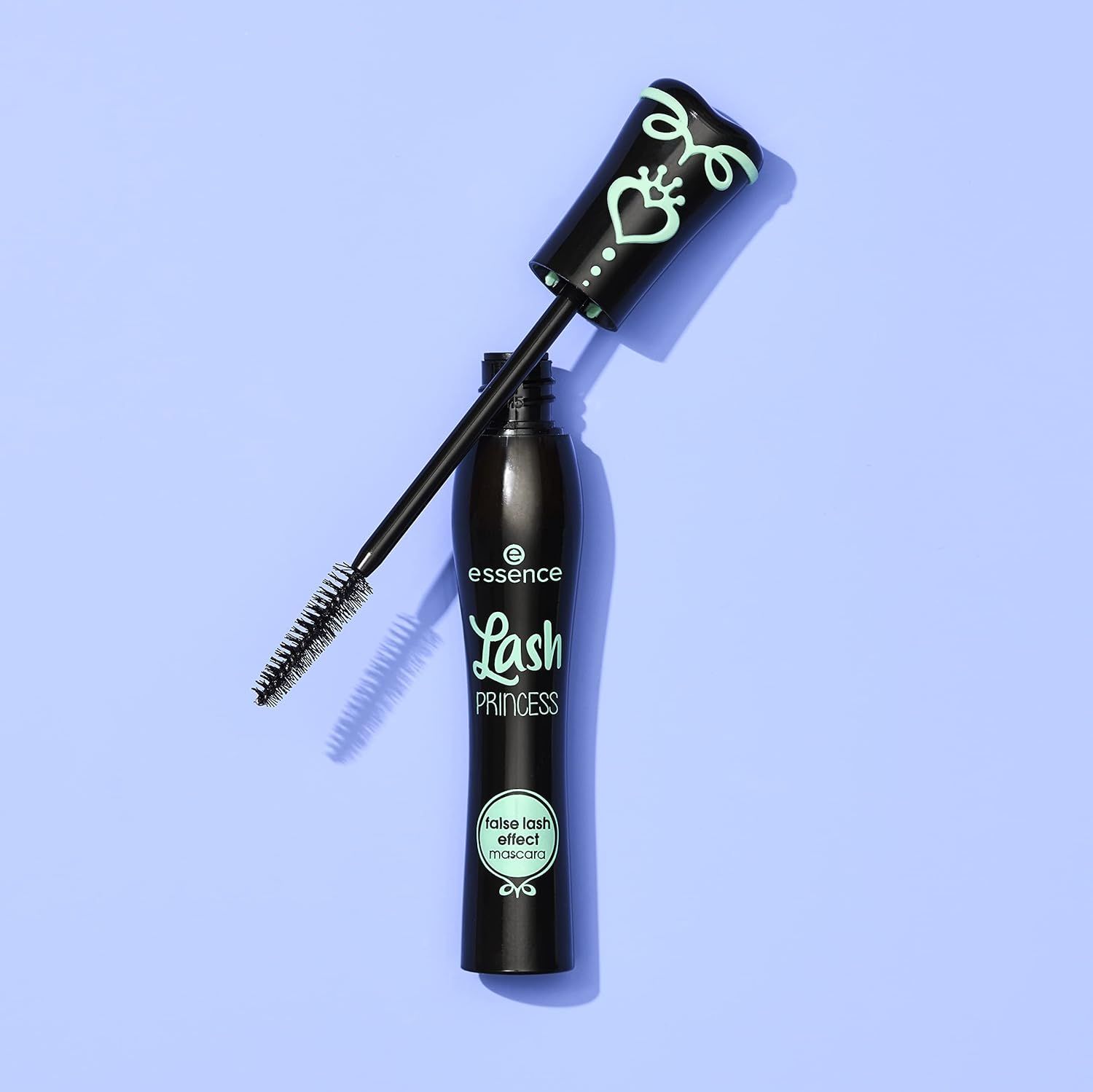 Shows the mascara product with its applicator wand extended to give shoppers a clear view of the brush design and product packaging in a clean, catalog-style presentation.