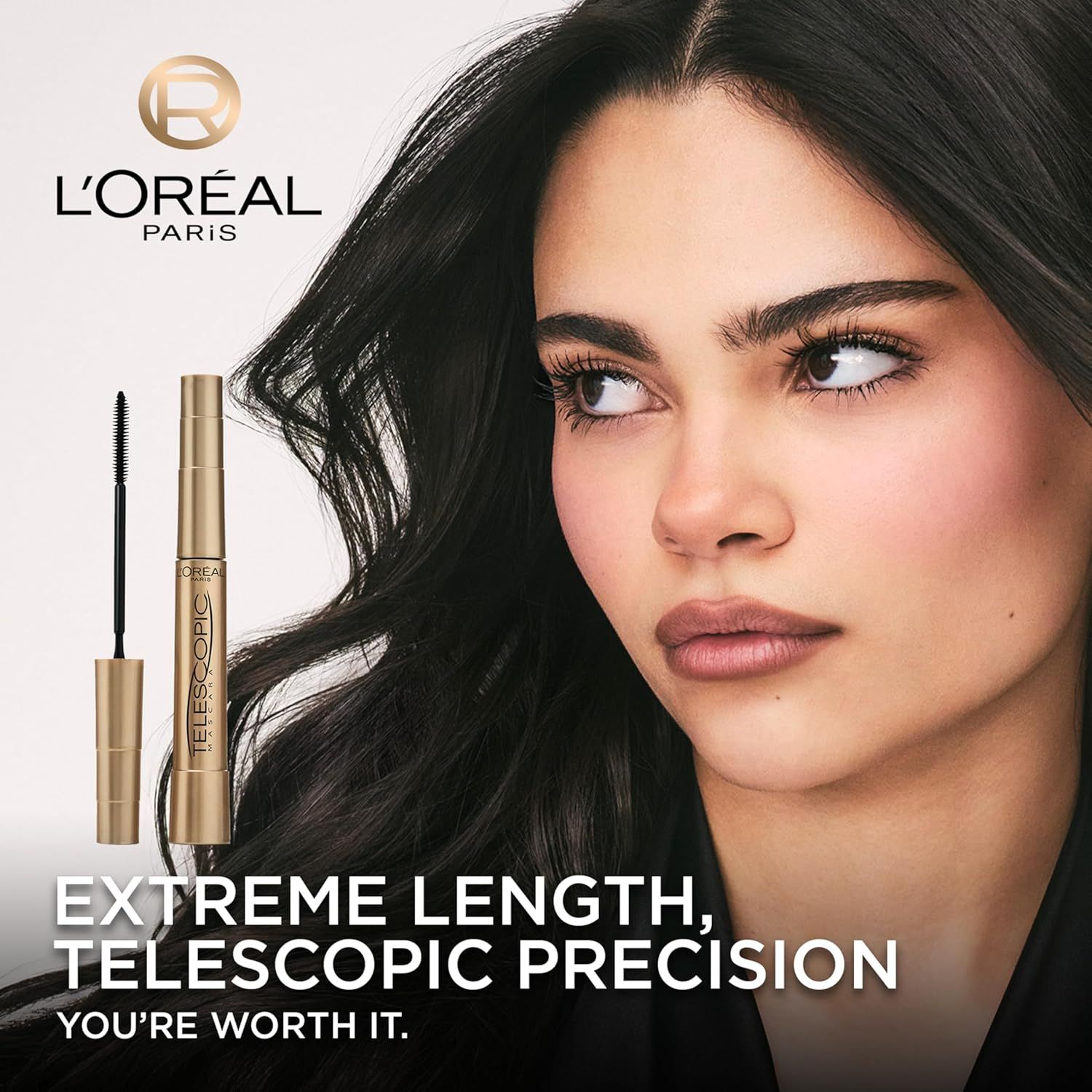 This image establishes L'Oréal Paris brand identity and emotional connection with the tagline 'YOU'RE WORTH IT,' while showcasing the Telescopic mascara product to build brand recognition and…