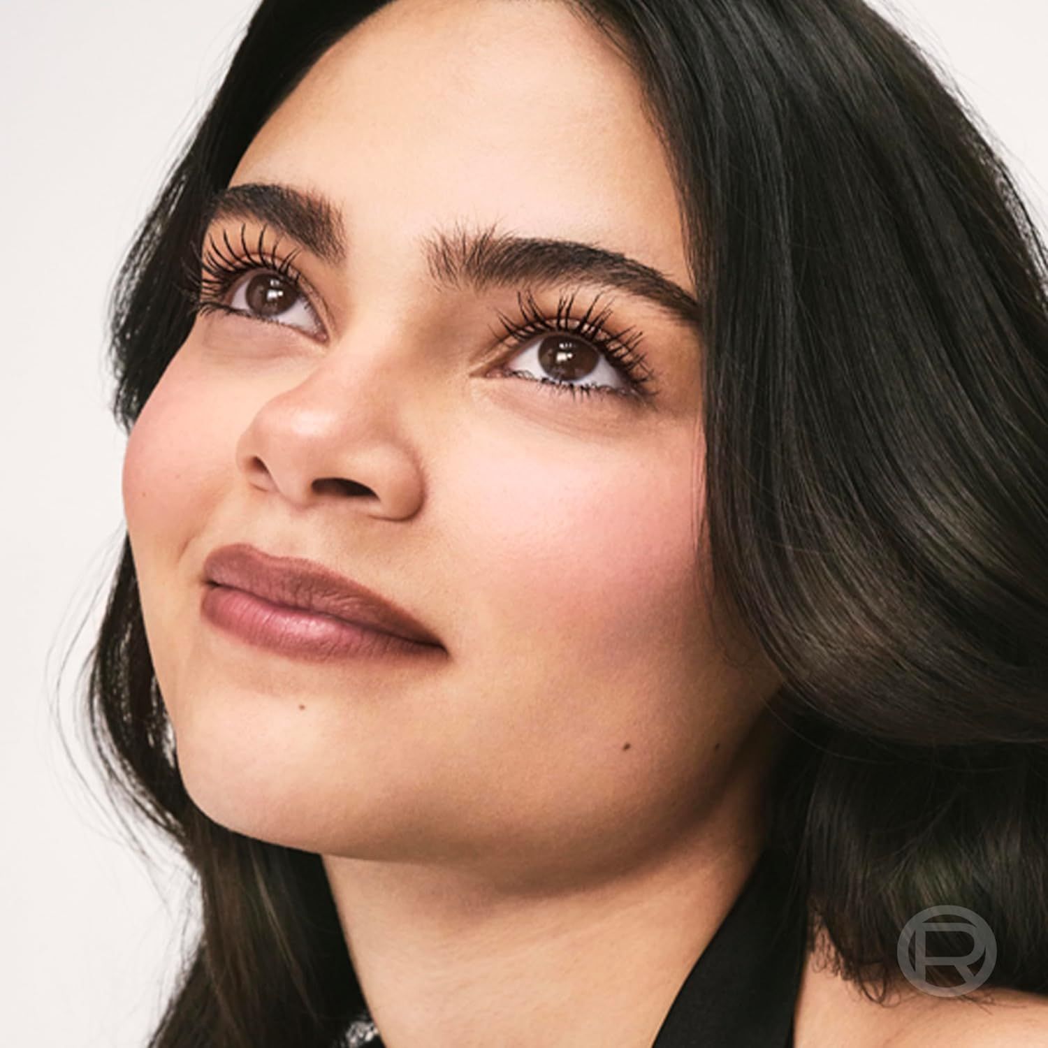 Showcases the product in use on a real person to demonstrate the natural, volumized lash effect and overall beauty enhancement the product delivers.
