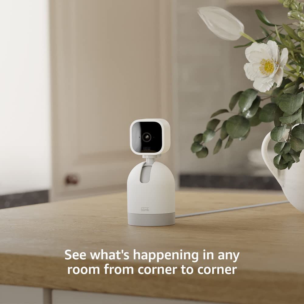 Communicates that the camera can rotate and provide comprehensive room coverage from corner to corner, reassuring shoppers of complete visibility.