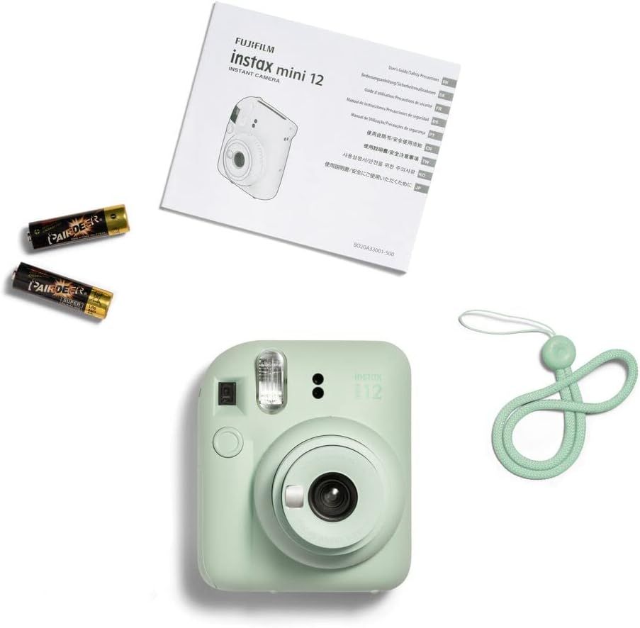 Shows everything included in the box to reassure shoppers they are getting a complete kit with the camera, batteries, instruction manual, and carrying strap.