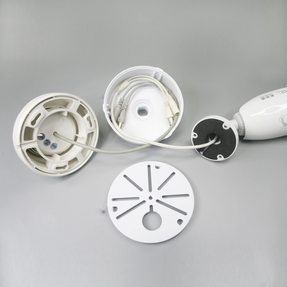 Shows the disassembled parts and internal structure of the security camera to help shoppers understand the build quality, installation components, and how the product is constructed. Demonstrates…