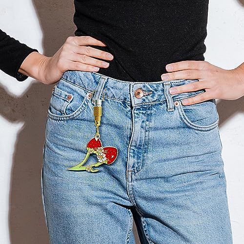 Shows the product (keychain or accessory) in a real-world lifestyle setting to help shoppers visualize how it looks when worn or attached to clothing.
