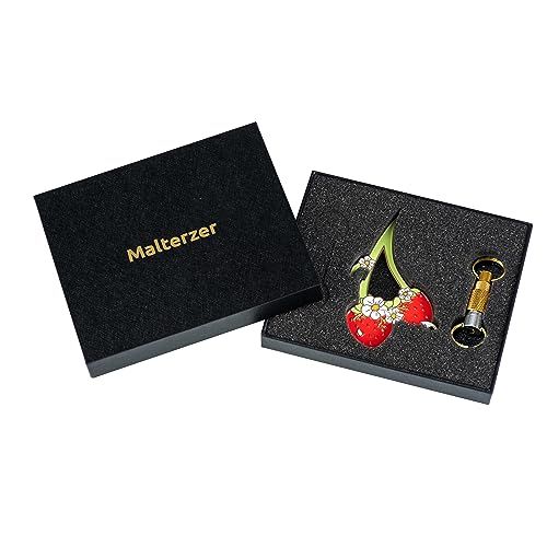 Shows the customer everything included in the purchase: the decorative cherry brooch and keychain accessories, presented in premium branded packaging.