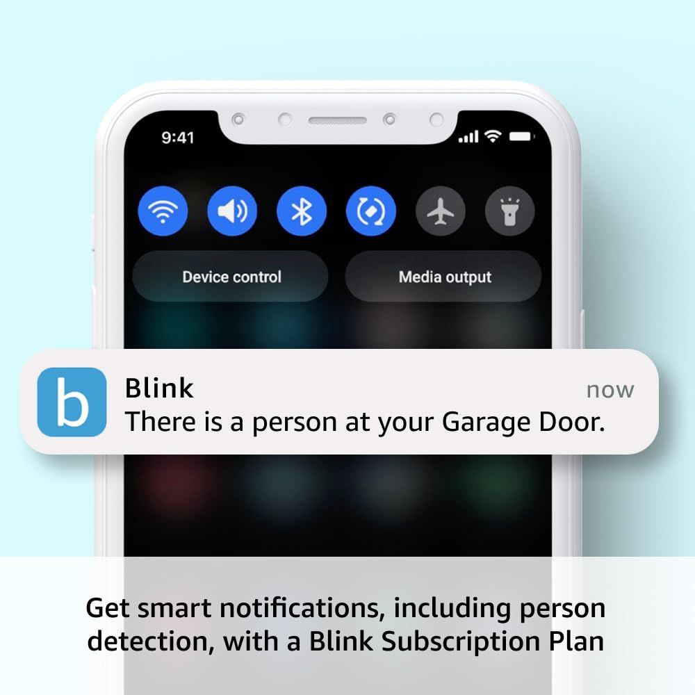Demonstrates the product's ability to send real-time mobile notifications when a person is detected at the garage door, reassuring shoppers about security and awareness features.