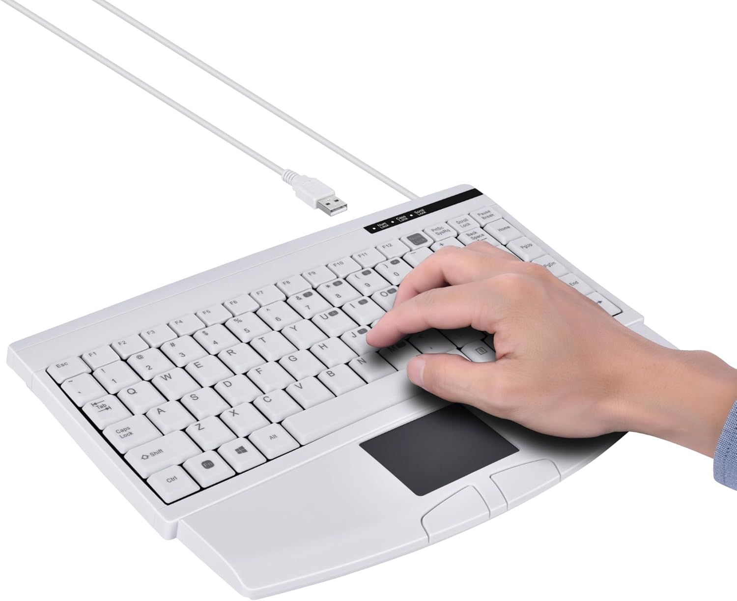 Shows the product being used in a real-world context with a hand interacting with the keyboard and touchpad, demonstrating its practical functionality and ergonomic design.