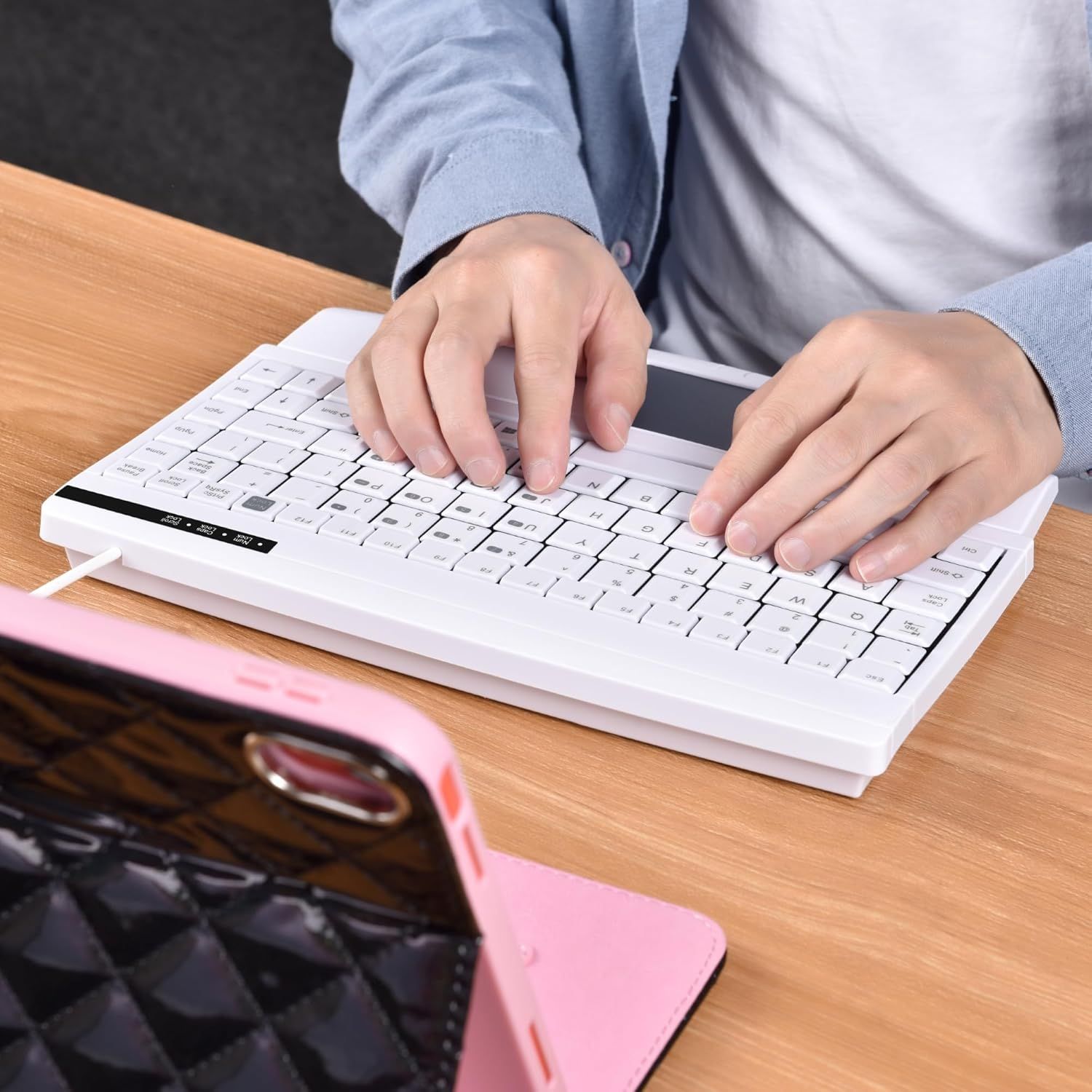 Demonstrates the product in a natural work environment to help shoppers visualize how the keyboard fits into their daily routine.