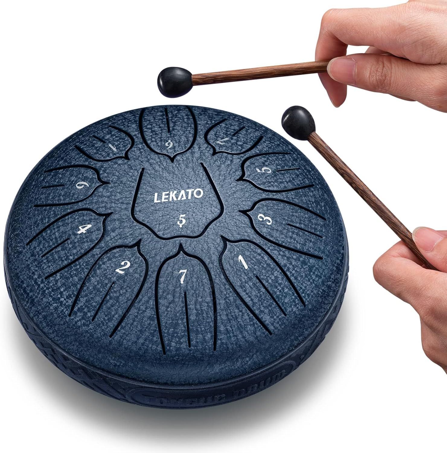 Demonstrates how to use the steel tongue drum by showing proper hand positioning and mallet technique, reassuring shoppers that the instrument is easy to play. Communicates that the product is…