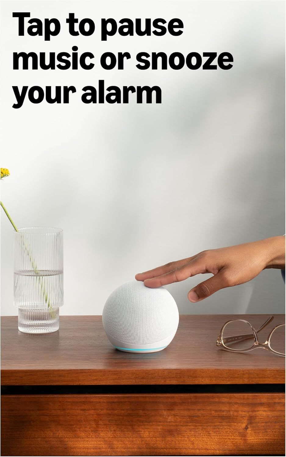 Demonstrates how to use the tap-to-pause feature for music and alarm snooze, showing the product's intuitive touch control interface.