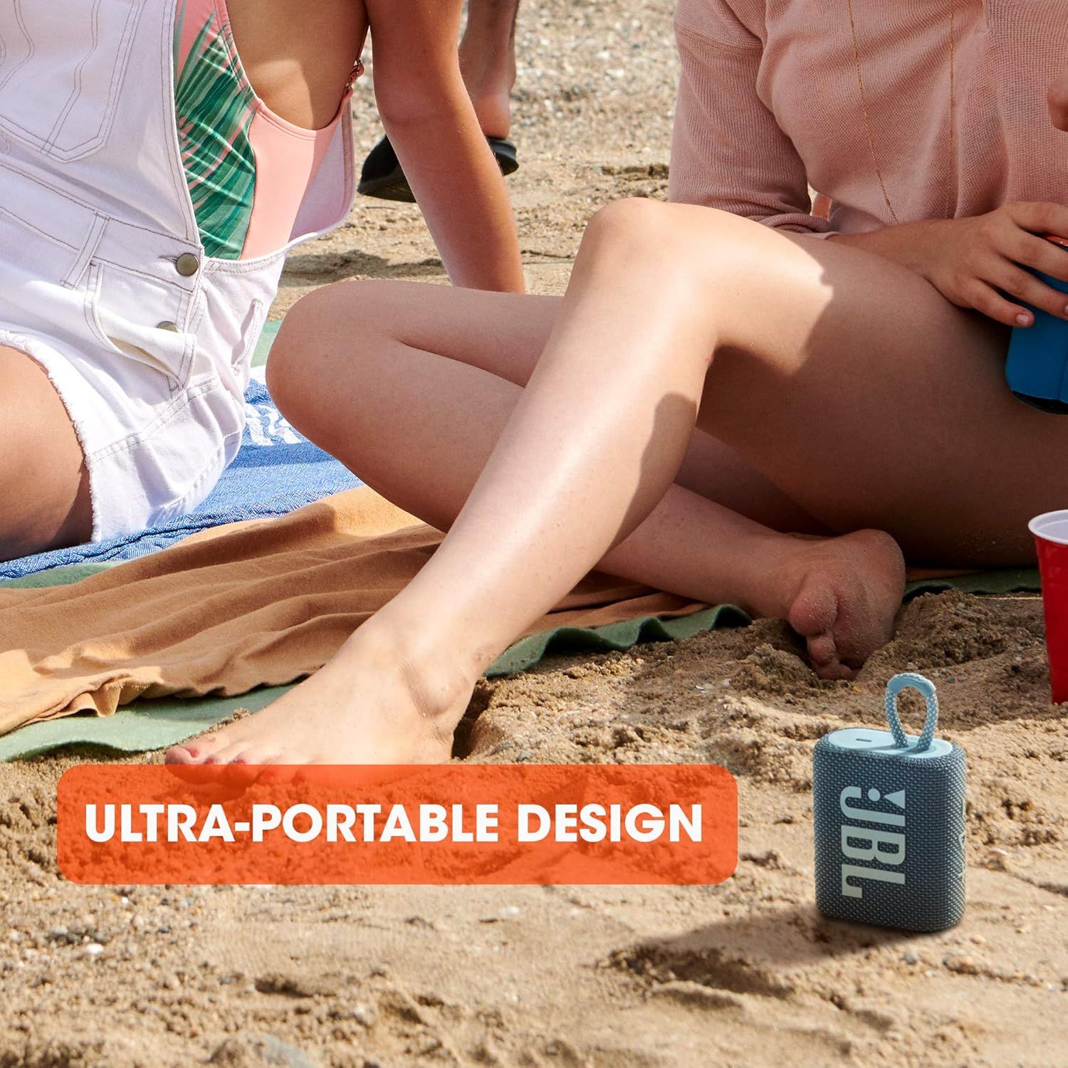 Demonstrates the product in a real-world beach setting to show its portability and suitability for outdoor leisure activities. Highlights the compact, portable nature of the speaker with a clear…