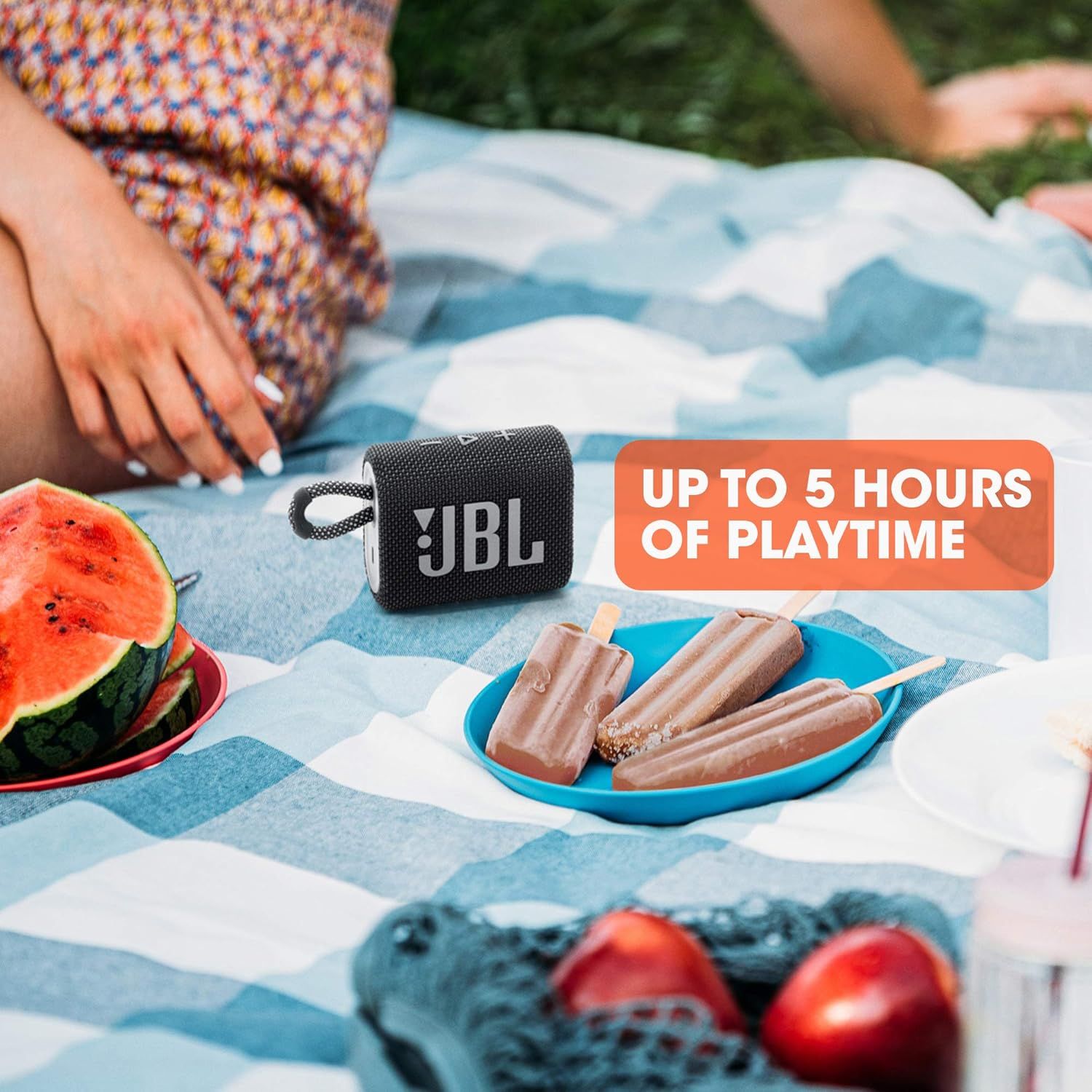 Communicates the speaker's long battery life (up to 5 hours of playtime) to reassure shoppers they can enjoy extended use during outdoor activities and gatherings. Shows the JBL speaker in a…