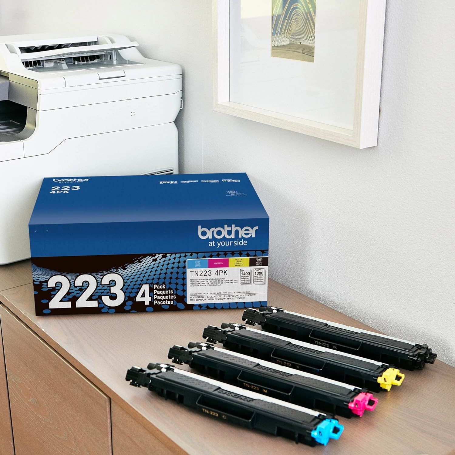 Shows the customer exactly what's included in the package: the product box and all four color toner cartridges they will receive, providing clarity on the bundle contents.