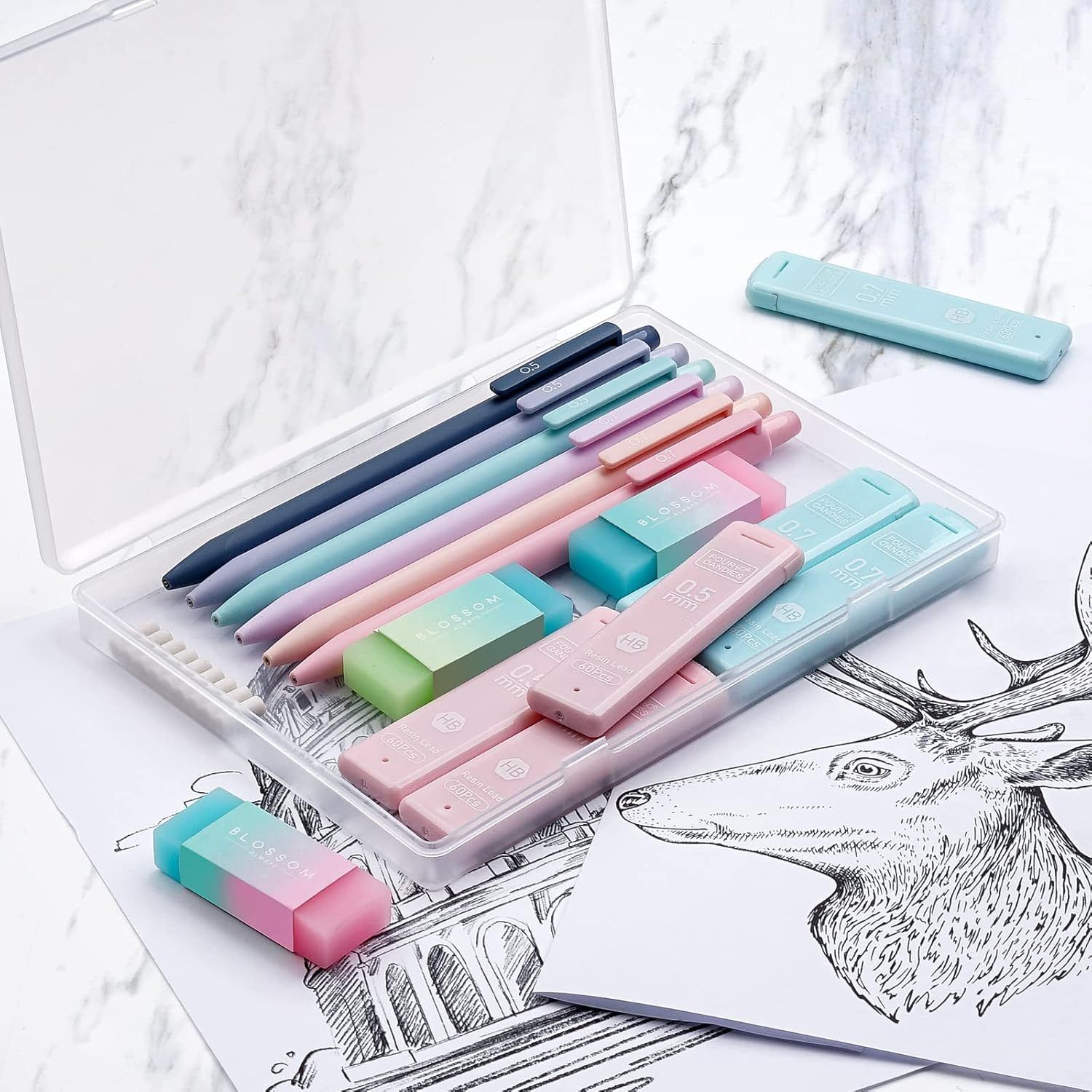 Shows the customer everything included in the purchase—a complete set of pens, erasers, and rulers organized in a clear storage case—to communicate value and convenience.