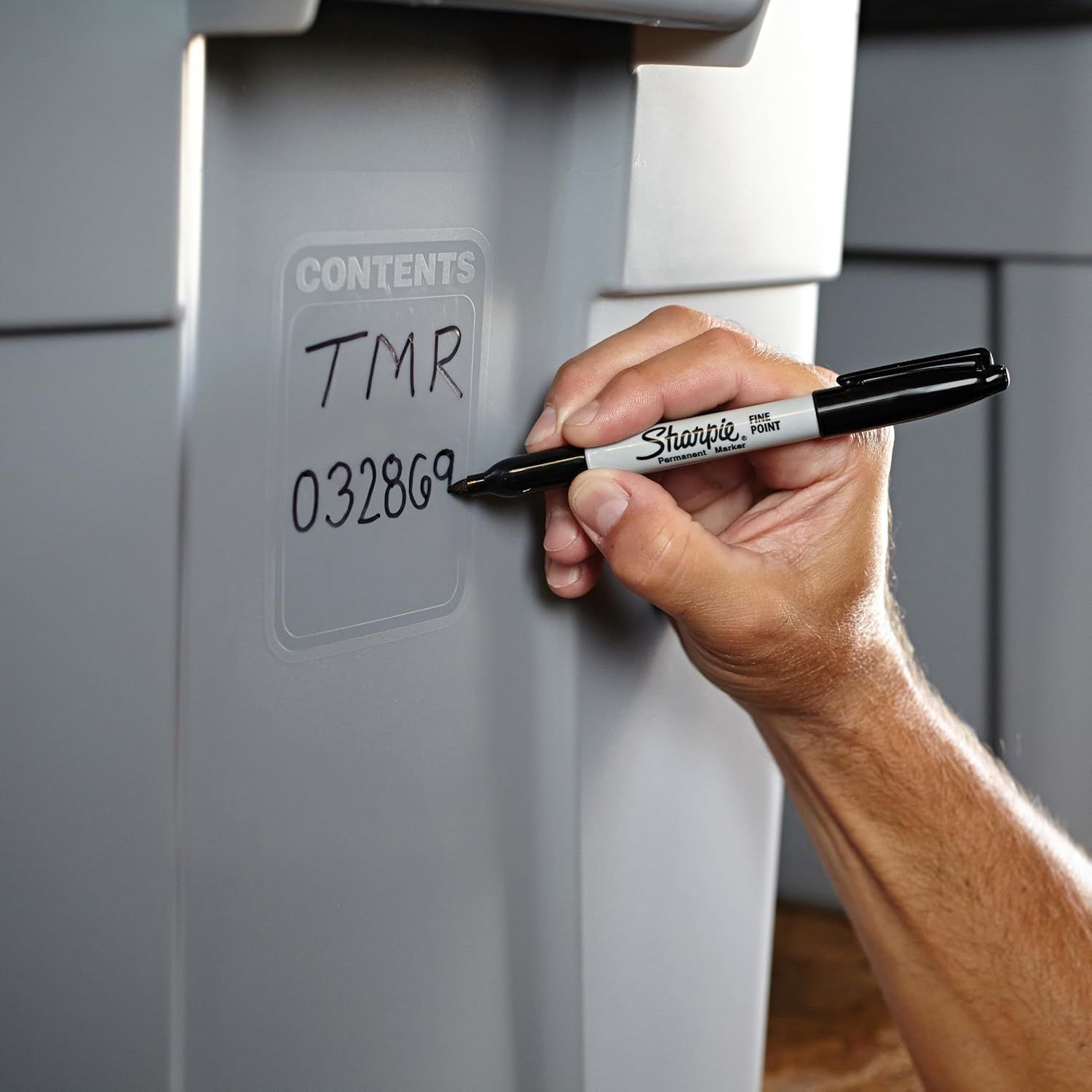 Demonstrates that the product has a writable surface for labeling and organizing contents, making it practical for storage and identification.