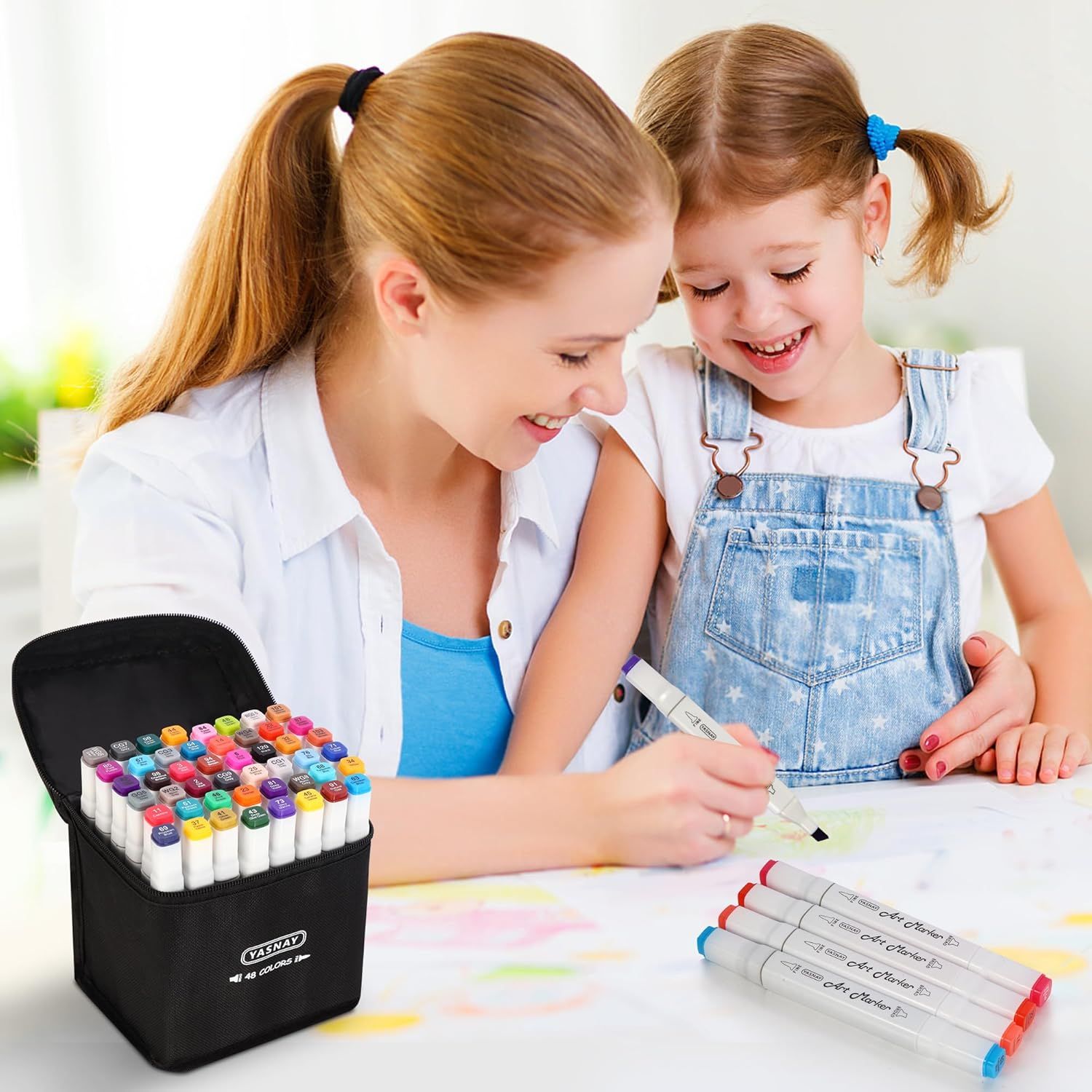 Shows the product being used in a real-world family setting to help shoppers visualize how the markers can be enjoyed by both adults and children during creative activities together.