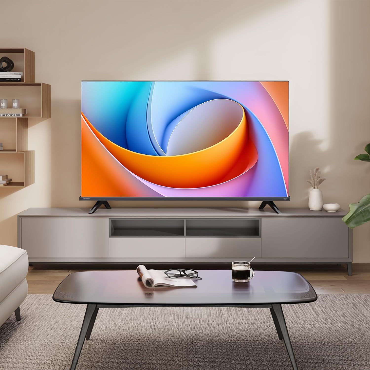 Demonstrates the television in a real-world home environment to help shoppers visualize how the product would look and fit in their own living space.