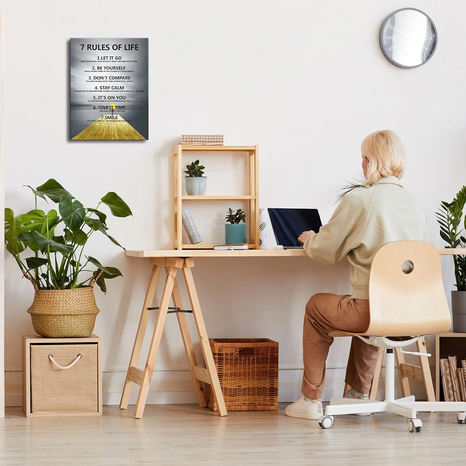 Demonstrates the product (wall art) in a real-world home office setting to help shoppers visualize how it would look in their own space.