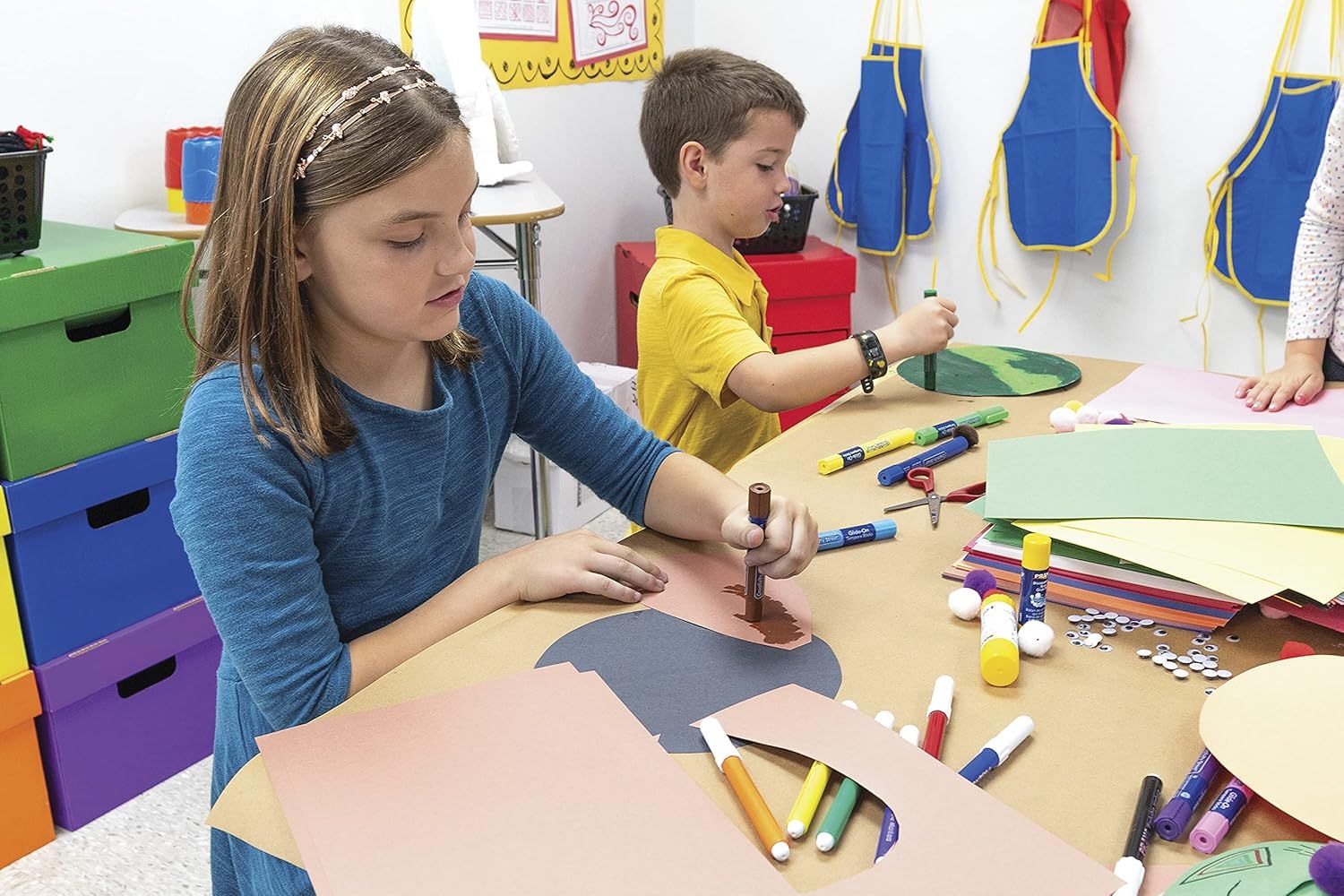 Demonstrates the product being used in a real-world educational setting with children engaged in creative activities, helping shoppers visualize the product in action.