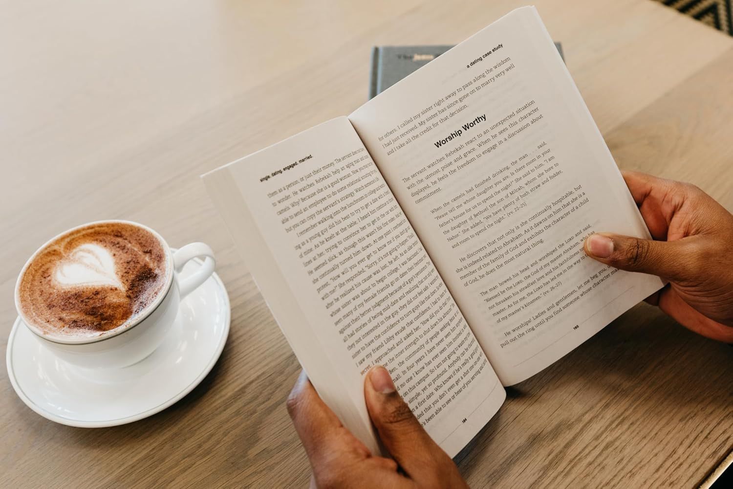 Showcases the product in a real-world, relatable setting to help shoppers visualize using the book in their daily life, creating an aspirational and calming lifestyle association.