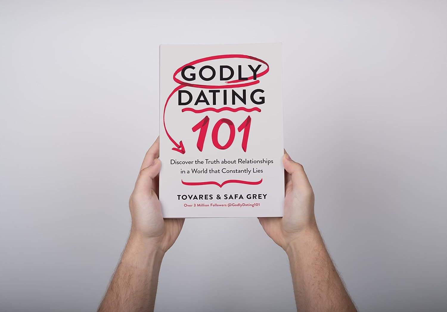 Shows the product (book) in a clean, catalog-style presentation with hands holding it to provide scale and context, allowing shoppers to see the cover design and title clearly.