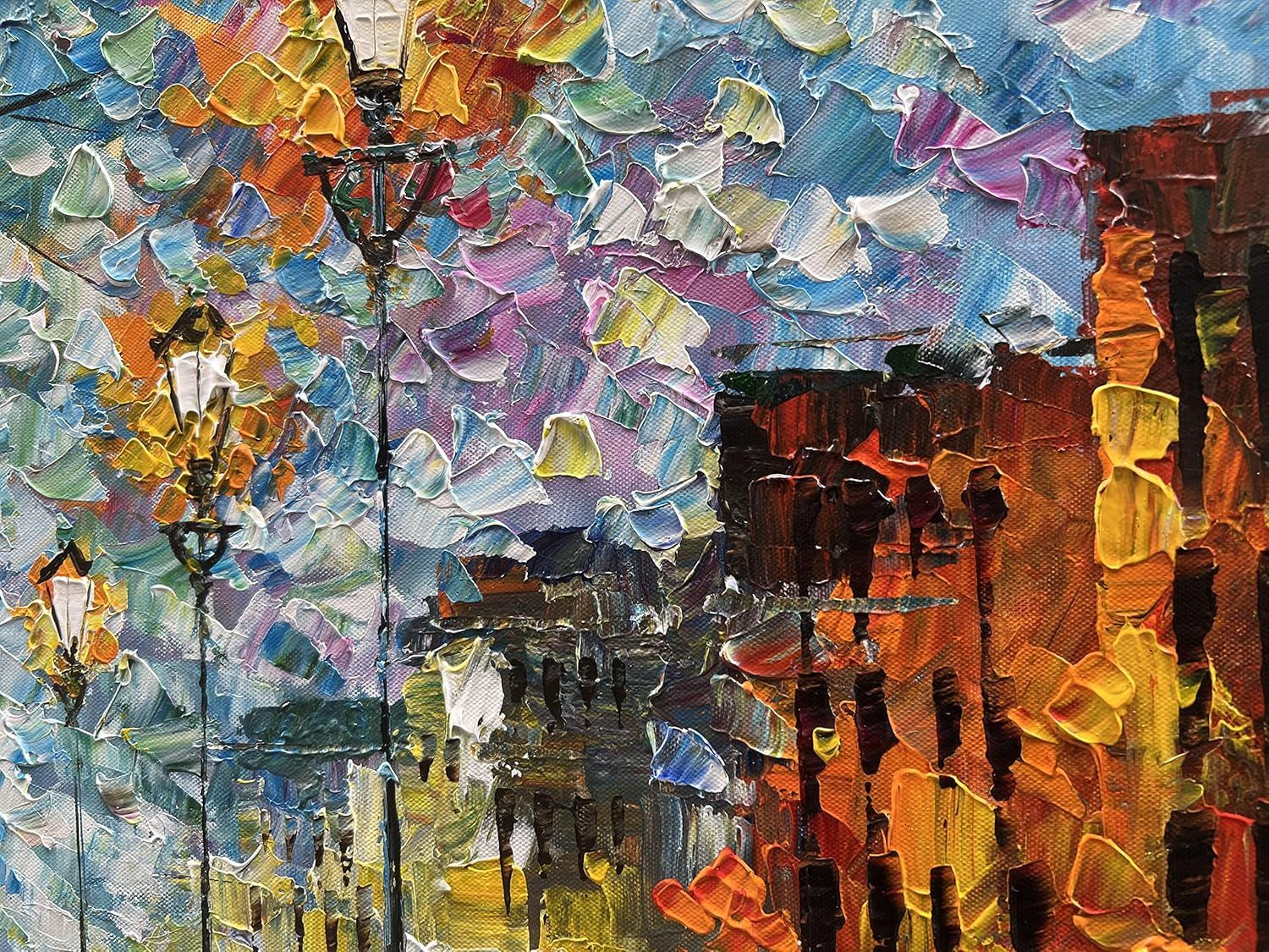 This appears to be an artistic painting or decorative artwork, not a product image. It shows a colorful impressionist-style scene with buildings and street lamps, likely intended as wall art or home…