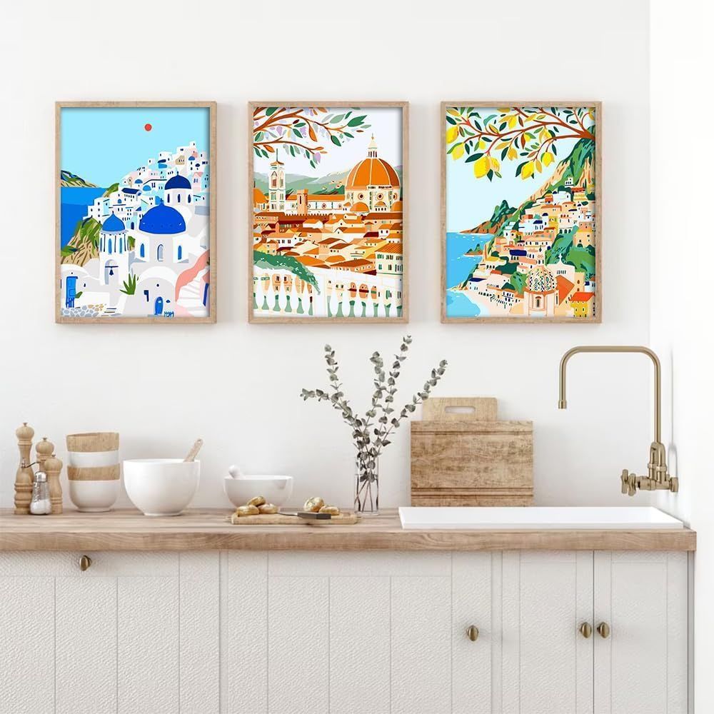 Demonstrates how the framed art prints look when displayed in a real kitchen setting, helping shoppers visualize the product in their own home.